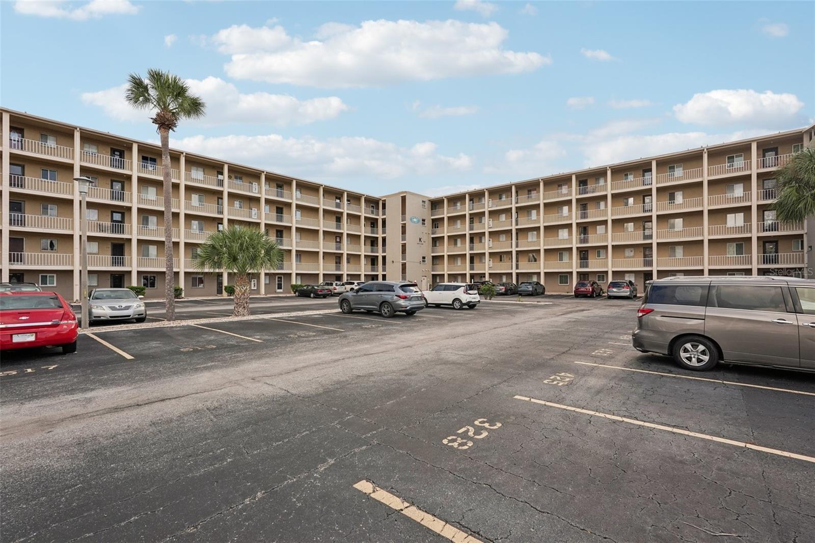 Beautiful 2-bedroom, 2-bath condominium on the 2nd floor in the sought-after 55+ Lake Bayshore Condominiums community in Bradenton, FL. This peaceful mid-rise 5-story building with elevator access offers a comfortable and maintenance-free lifestyle perfect for active adults. Relax and savor stunning lake views from your private balcony—ideal for morning coffee or evening sunsets. Enjoy the great outdoors with plenty of loungers perfect for relaxing or soaking up the sun. The vibrant community offers a heated pool, clubhouse, and a convenient grilling area ideal for summer cookouts and gatherings. Located just steps from Cortez Road, you’ll have easy walking access to everyday shops and services, with public transportation available right at the corner. Plus, you’re a short drive from downtown Bradenton, SRQ airport, beautiful Gulf beaches, and only 50 minutes from Tampa airport. Convenient assigned parking and well-kept common areas complete this exceptional lifestyle. Schedule your private tour today!