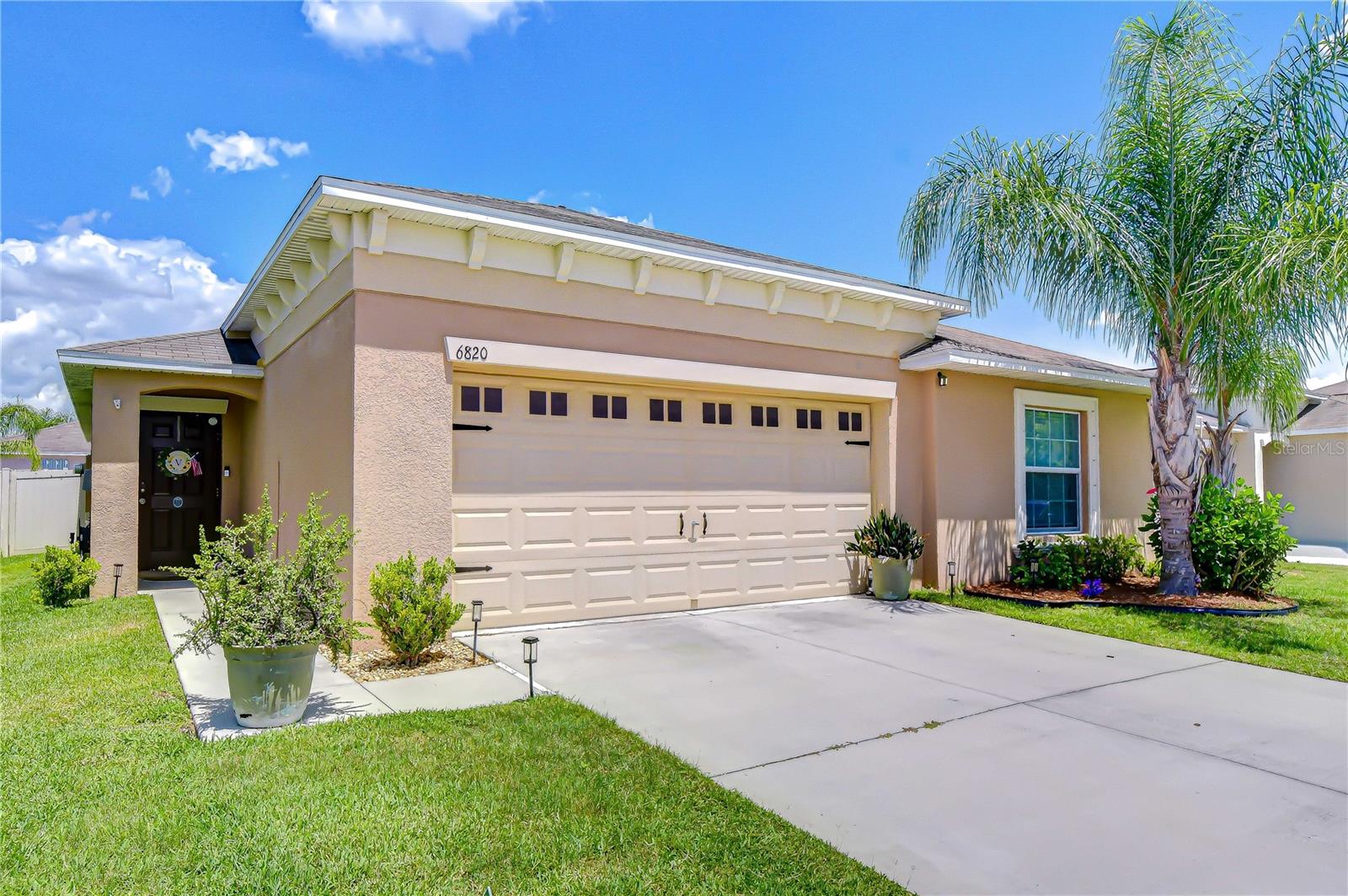Welcome to this beautifully designed 4-bedroom, 2-bathroom split floor plan home with a spacious two-car garage, located in the desirable Cypress Creek community. Offering a bright and airy open-concept layout, this home is filled with natural light and provides the perfect balance of comfort, style, and functionality for both everyday living and entertaining. At the heart of the home, the expansive living area offers plenty of room to gather with family and friends, while the well-appointed kitchen overlooks the main living space and is thoughtfully updated with a stylish backsplash, large center island with bar seating, a stone façade accent on the island, a modern single-basin sink, and generous pantry storage. The thoughtfully designed split-bedroom layout provides added privacy, with all bedrooms generously sized and updated with beautiful engineered hardwood flooring, creating a warm and cohesive feel throughout. The spacious primary suite serves as a peaceful retreat, complete with a large walk-in closet and an en-suite bath featuring dual vanities. Additional conveniences include an indoor laundry room and plenty of storage throughout. Step outside to enjoy the fully fenced backyard, ideal for pets, play, or relaxing evenings outdoors. The paver patio creates a great space for grilling, entertaining, or simply enjoying Florida’s beautiful weather. Residents of Cypress Creek enjoy access to exceptional community amenities including a resort-style pool, clubhouse, playground, pickleball courts, and dog park. Conveniently situated near shopping, dining, medical facilities, and entertainment, this home also offers easy access to outdoor recreation such as E.G. Simmons Park, Little Manatee River State Park, beaches, boating, golf, and more. Located in a high and dry non-flood zone, this home offers peace of mind along with an outstanding lifestyle opportunity. Don’t miss your chance to make this Cypress Creek gem your own—schedule your private showing today!