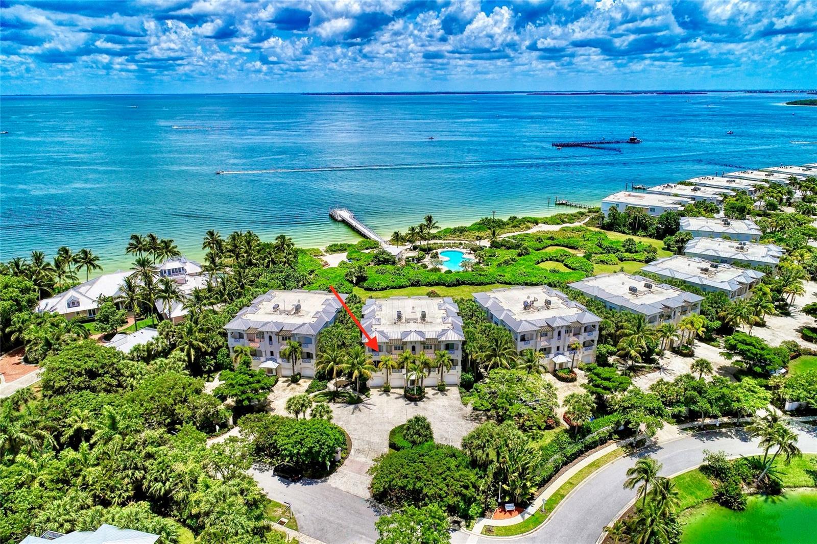 Enjoy serene bayside living in this beautifully appointed 3-bedroom, 2-bath Harborside condominium in Boca Bay. Framed by lush natural surroundings, the spacious screened lanai offers a front-row seat to tranquil water views and coastal wildlife, an ideal setting for morning coffee or sunset unwinding.
The interior blends classic elegance with thoughtful craftsmanship, featuring generous ceiling heights, custom millwork, and charming glass transoms above interior doors. Plantation shutters adorn the windows, complementing the impact glass windows and doors throughout the residence.
Designed for ease and comfort, revel in the convenience of single-level living, complemented by the inclusion of a private garage, a separate storage room, and effortless elevator access—offering the epitome of a 'lock the door and leave' bayside retreat.
Just outside your door, Boca Bay’s resort-style amenities invite you to relax and recharge. Enjoy multiple community pools, a bayside beach, and a fishing pier only steps away. The private Gulf-front Boca Bay Pass Club offers beachfront dining in an exceptional setting, while seven Har-Tru tennis courts and a fully equipped fitness center support an active island lifestyle.