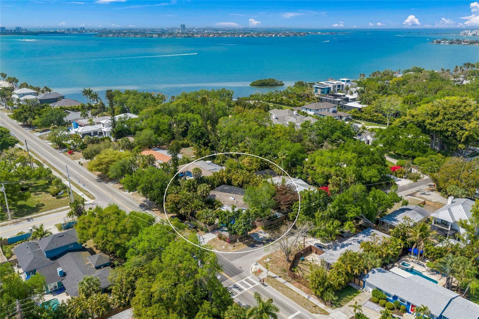 Craving a low-maintenance, island-inspired lifestyle just moments from sparkling open water, world-famous beaches, and Sarasota’s most coveted destinations? This quaint Florida bungalow located in west of trail delivers the perfect blend of charm, location, and effortless living—just minutes to Siesta Key and steps from the coastal lifestyle you’ve been dreaming of.

Tucked away in one of Sarasota’s most desirable “West of the Trail” neighborhoods, 3424 Old Oak Dr has been thoughtfully redesigned to preserve its original character while introducing timeless, modern updates. From the moment you arrive, the lush tropical landscaping, winding garden paths, and private courtyard-style entry create a warm, inviting ambiance that feels like your own hidden oasis.

Inside, the home showcases a light-filled, airy design highlighted by vaulted wood-beam ceilings, soft coastal tones, and an open-concept layout that seamlessly blends comfort and style. The beautifully updated kitchen features granite countertops, open shelving, stainless steel appliances, and designer finishes, creating a space that is both functional and visually stunning. The living area centers around a charming wood-burning fireplace, adding warmth and character, while French doors invite natural light and connect indoor and outdoor living spaces effortlessly.

The home offers flexible living spaces ideal for a primary residence, seasonal retreat, or income-producing property. Each room reflects a curated, coastal aesthetic with tasteful updates while maintaining the home’s unique bungalow charm.

Step outside to your private backyard sanctuary, where a screened-in heated pool is surrounded by mature tropical landscaping, creating a serene and secluded environment perfect for relaxing or entertaining. An outdoor shower adds to the coastal lifestyle experience, while multiple seating areas and garden spaces enhance the home’s tranquil, resort-like feel.

Located just minutes from Siesta Key Beach, Southside Village, downtown Sarasota, Sarasota Memorial Hospital, and top-rated dining and shopping, this home offers unmatched convenience paired with a laid-back coastal lifestyle.

Rarely does a property combine location, charm, income potential, and lifestyle so seamlessly. This is your opportunity to own a truly special Sarasota bungalow where every day feels like a vacation.