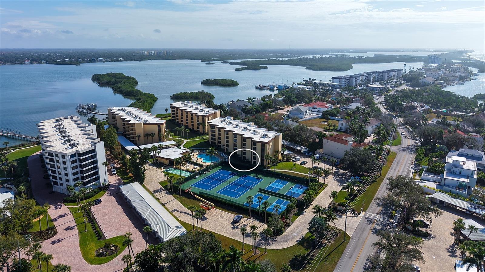 Welcome to Island Reef, a fantastic Beach to Bay Luxury Resort-Style Complex on South Siesta Key. This rarely
 available first floor condo offers it's owners the ultimate in convenience with easy parking at the front door. Step
 out your back glassed lanai to the pool and tennis /pickleball courts, and beautiful courtyard. This 2 bedroom/2
 bathroom condo is fully furnished and has been used as a vacation home and part-time rental. There is an open floor
 plan with split bedrooms, a glassed lanai, kitchen dinette, inside laundry, and a pass-through kitchen to the Living
 and Dining area. Recent updates include luxury vinyl plank through-out, and tile floors in the lanai. New area rugs
 and coastal furnishings create a comfortable, easy-care setting. There is ample storage with full-wall closets in
 the guest bedroom, a walk-in closet in the Master Bedroom, and a linen and entry closet and large storage room off
 the foyer. Amenities at Island Reef are second to none. Enjoy a swim or aerobics class in a choice of 2 heated
 pools. The updated clubhouse can be reserved for personal use and is the site of the many social events. Other
 amenities include; a game room, library, fitness room, dock, beach frontage, pickleball and tennis courts,
 shuffleboard, kayak and bike storage and an active social program. There is an inhouse rental program and on-site
 manager. If you want to head to the Siesta Key Beach, the SK Village, and beyond, you can pick up the free Trolley
 from the Island Reef Entrance.  Walk to Turtles Restaurant or Turtle Beach Park or rent a boat from the nearby
 Marina. If you have always wanted to live in Paradise, here is your opportunity at a great price!  This unit is SOLD
 AS-IS. The dock is in the process of being rebuilt and will be done in June.  There is a short waiting list for those who would want to rent a dock.
