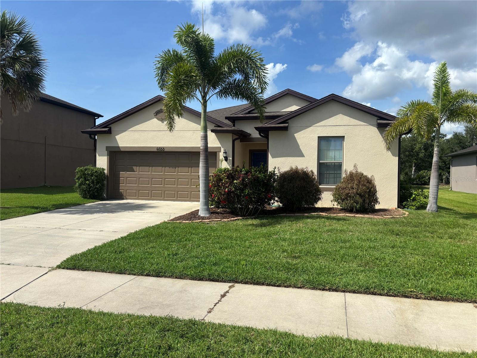 MOVE IN INCENTIVE = 50% OFF 1st 2 month's rent -- This 3 bedroom, 2 bath, 2 car garage home has a large living room/kitchen open floor plan and includes granite kitchen countertops, updated appliances, fresh paint and tile in the main living area, kitchen and wet areas. Being located in Parrish at Harrison Ranch provides easy access to either Tampa or Sarasota.  The fast-growing area of Parrish and North River Ranch offer tremendous infrastructure improvements such as a new Hospital, schools, shopping, dining and entertainment.  Lawn care included with rent and pets allowed upon approval in writing by owner and management.