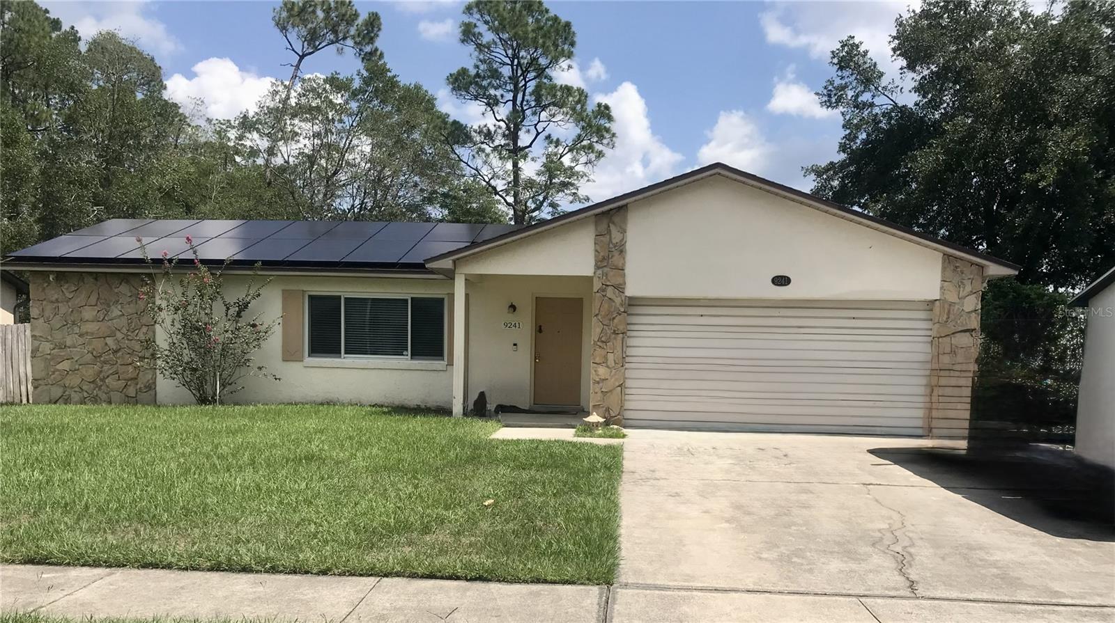 Welcome home to this charming 3-bedroom, 2-bath residence in the desirable Woodsong community of East Orlando. Recently updated with new flooring throughout, updated kitchen, new plumbing and hurricane resistant window. Designed with an inviting split-bedroom floor plan, this home offers the perfect balance of privacy and functionality, featuring both a spacious family room and a bright living and dining area—ideal for everyday living and entertaining. Step into the enclosed rear porch, where you can relax with your morning coffee while overlooking the fully fenced backyard with no rear neighbors creating a peaceful setting that's hard to find. The generous lot provides plenty of space for outdoor gatherings, gardening, or simply enjoying Florida's beautiful weather.
Location is everything, and this home delivers. Just minutes from UCF, Valencia College, Full Sail University, major highways, shopping, 
dining, and Orlando International Airport, you'll enjoy easy access to work and school.
Whether you're a first-time homebuyer, downsizing, or searching for a smart investment opportunity, a desirable location, and the chance to make it your own. Don't miss this opportunity to own a home that combines comfort, convenience, and endless potential in one of East Orlando's most accessible neighborhoods.
MORE PICTURES to come. Buyers agent to verify all measurements