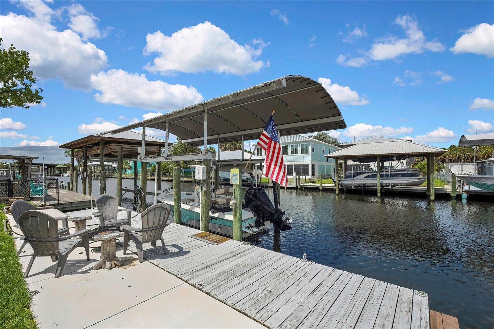 This is a must see! Fully Remodeled Inside & Out! This Waterfront Retreat offers the Ultimate Florida Coastal Lifestyle! This home sits on a Deep-Water Canal with 50 feet of waterfront and Direct Access to the Gulf of America, making it a Dream Location for Boaters, Anglers, and Nature Lovers alike. Completely renovated, this Turnkey Home features All New Wiring and Plumbing, 3 New A/C mini-split systems, and Stylish Modern Finishes throughout. The Beautifully Updated Kitchen includes Quartz Countertops & Backsplash, New Cabinets, & Brand-New Stainless-Steel Appliances, while the Beautifully Remodeled Bathroom Includes a Spacious Walk-In Shower. Step outside and enjoy true Waterfront living with your own Upper & Lower Dock with Electric & Water hooked up. Fish right from your backyard. Tarpon, Bass, Mangrove, and more! Watch manatees, dolphins, otters, and other native wildlife cruise through the canal while you relax waterside. The Double Cable 9,000-pound Boat Lift is Ready to House your Small or Large Boat. The property is Fenced along the sides with Gated access to the backyard, adding privacy and convenience. Located just off the Crystal River, you can easily hop on your boat and explore Kings Bay, Three Sisters Springs, and the many natural springs the area is famous for. Minutes to marinas, boat ramps, local parks, and beaches, this property offers endless opportunities for boating, scalloping, fishing, kayaking, and biking.