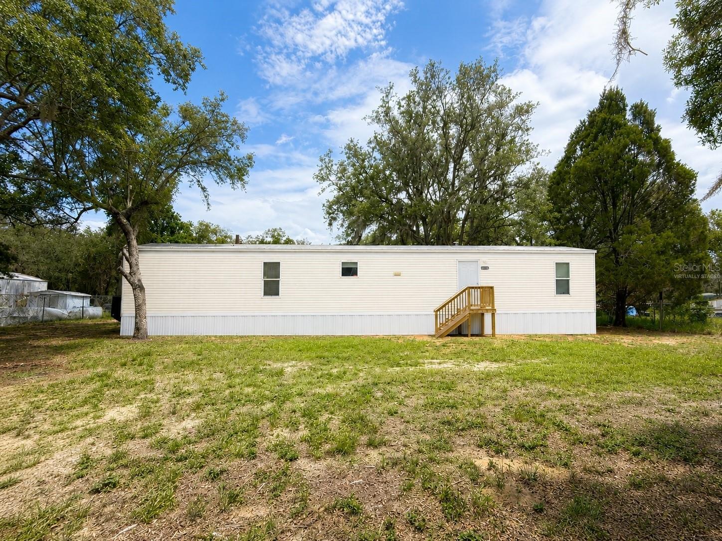 Accepting USDA and VA financing

Welcome to this charming 2002 single-wide mobile home nestled on a quiet half-acre lot in the desirable Lake Pierce Ranchettes subdivision — just steps from Lake Pierce Ranchettes Park. Freshly painted inside, this move-in-ready 3-bedroom, 2-bathroom home blends comfort, convenience, and accessibility.

The interior features handicap-accessible layouts, in-home laundry, stainless steel appliances, and an updated electrical panel — giving you modern peace of mind from day one. An in-home fire sprinkler system adds an extra layer of safety, and the home comes backed by a 1-year warranty.

Outside, the fully fenced half-acre lot features chain-link fencing with two gates, offering security and privacy. The property is connected to city water and runs on a private septic system. Seller is offering owner financing — making this an exceptional opportunity for buyers seeking flexible terms.

Don't miss your chance to own a piece of peaceful Florida living with room to breathe and a park right next door.