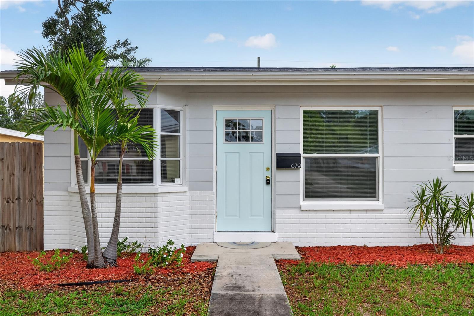 Step back into a 1960's neighborhood feel with this Solid Concrete Home for sale in a very peaceful  neighborhood just one block from 4th Street North. Enjoy Waterproof luxury vinyl flooring throughout the home. Feel secure knowing The roof and windows are only 3.5 years old. The rest of the home was remodeled 3.5 years ago as well. This home will need nothing major for many years. The Living room has high vaulted ceilings with dark wood beams. The Kitchen has stainless steel appliances, real wood shaker cabinets and quartz countertops. A Large Bonus room can easily be converted into a second bedroom. Outside the back door is a breezeway with a wood plank ceiling leading to a garage with a bathroom. The garage can be converted into a separate living area for extra income or as an in-law suite. Next to the garage is a covered carport. You will love the zen feel of this property. So tranquil! and less than 100 yards from Fossil park where your family can enjoy baseball, basketball, skating in the skate park, walking and riding bikes. Everything you need is within walking distance including a bowling alley. This cute home being Just one block off of fourth street allows for a quick commute to Tampa while being just 10 minutes from downtown Saint Petersburg. Must see this home to appreciate.