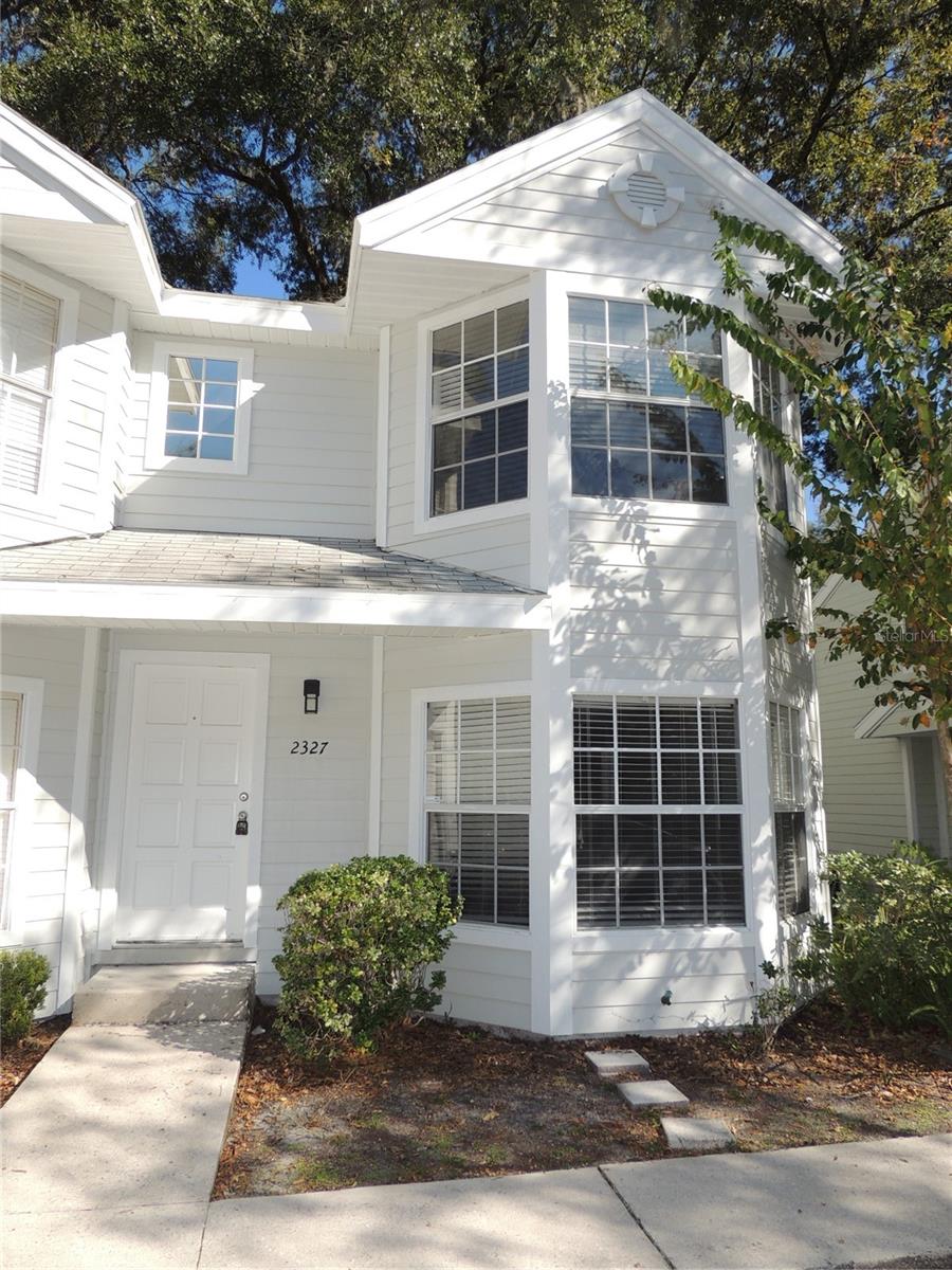 Welcome to Quaint and Charming Carriage House Lane, a small PUD community conveniently located in SW Gainesville in close proximity to Butler Plaza shopping and on bus route to UF/Shands, VA, & Vet School. This spacious 2 bedroom/1.5 bath townhome offers tile flooring downstairs, a cozy wood burning fireplace, picturesque large bay window, nicely equipped kitchen with dining and breakfast bar and half bath. Enjoy the private and peaceful fenced back yard with wooden deck and patio area. Upstairs there are 2 bedrooms, laundry closet with washer/dryer with the master bedroom featuring a large walk-in closet and seperate vanity and sink. You can't miss on this!
