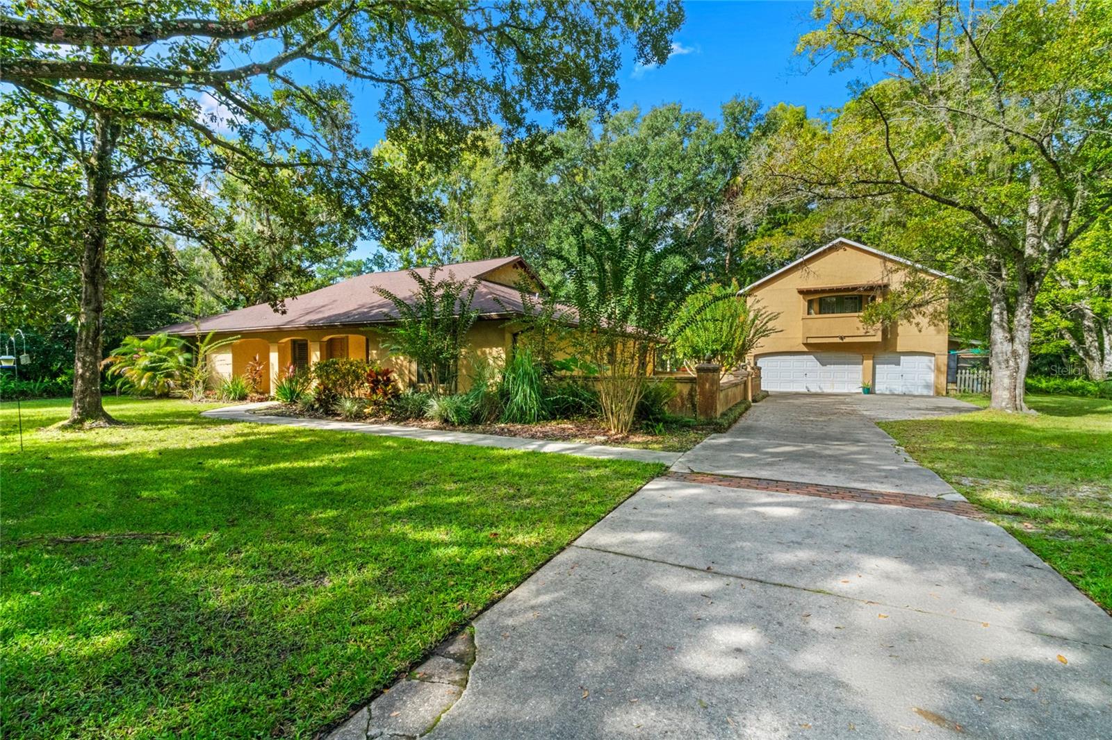 Unique natural property on an oversize lot with breathtaking water views and a custom-built backyard for entertaining, with hand laid stone walkways, sitting areas, fishing dock, and a tranquil fountain. Completely surrounded on all sides by woods and hedges providing total privacy, with lots of room for parking, RV, and boat storage – because there’s no HOA! Well maintained by the original owner with custom touches throughout the property both inside and outside. Private pond filled with bluegill and specks. Open floorplan with split bedroom configuration, and views of the outdoor areas abound. Separate 3 car garage with upstairs apartment framed in and ready to finish off the bedroom and bathroom. Lots of detail including built-ins and stained-glass window in the kitchen. Enjoy a peaceful country setting in the heart of Lake Mary just minutes from shops and restaurants. City water and new newer septic system. Roof replaced in 2017, drainfield in 2017, water heater in 2023, and a/c in 2013. Located on 1.4 acres with an additional 1.8 acre lot available next door – see MLS Listing  O6148715