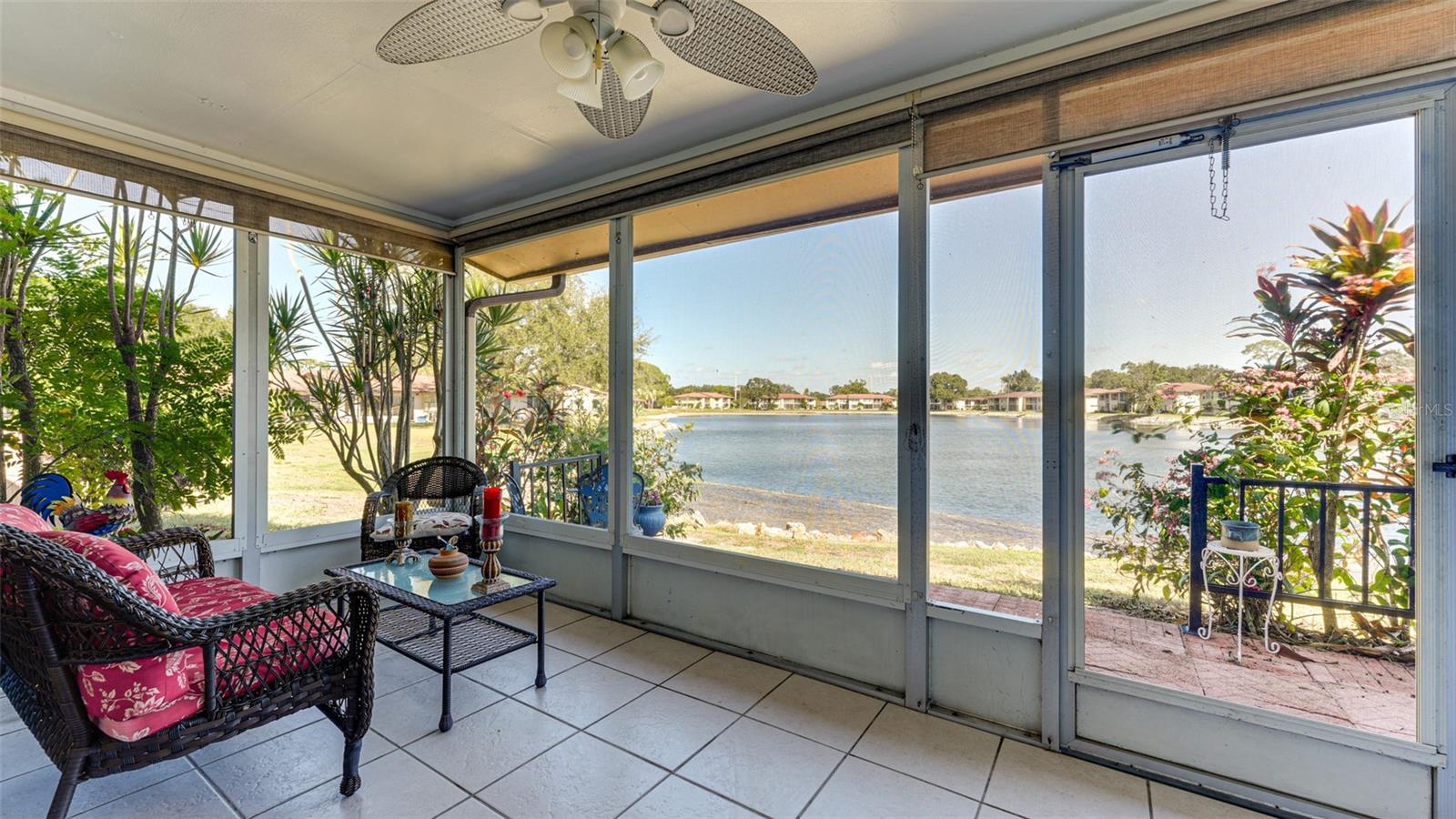 Unwind on your private covered lanai, where tranquil lake views stretch out before you—calm, glassy waters reflecting the sky and surrounding greenery, creating a peaceful backdrop that feels like your own personal retreat. Whether you’re enjoying a quiet morning coffee as the sun rises over the water or relaxing in the evening with gentle breezes drifting across the lake, this outdoor space invites you to slow down and savor the moment. Inside, the thoughtfully designed open floor plan seamlessly connects the living spaces, ensuring those beautiful water views remain the focal point from the main living area as well as the spacious primary suite. Natural light fills the home, enhancing the airy, relaxed feel throughout. A split-bedroom layout offers privacy for guests, with a well-positioned second bedroom and bath tucked away from the primary suite. Located in the peaceful 55+ community of Lake Tippecanoe, this charming villa offers not just a home, but a lifestyle. Residents enjoy a picturesque lakeside pool, shuffleboard courts, and an inviting clubhouse perfect for social gatherings and connecting with neighbors. Ideally situated just minutes from the world-renowned Siesta Key Beach and the vibrant culture, dining, and shopping of downtown Sarasota—approximately 7 miles away—this property is perfectly suited as a full-time residence or a seasonal retreat. With covered parking conveniently located just outside your front door, every detail has been considered for easy, comfortable living in a serene setting.