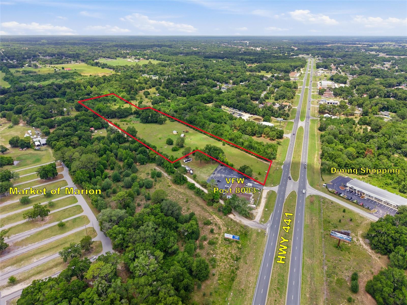 Position your business or next commercial development in one of Belleview’s most practical and established business corridors. This 12.8-acre B-4 zoned commercial property on U.S. Highway 441 offers the scale, visibility, access, and flexibility needed for a business owner, developer, investor, or regional operator looking to plant a flag in the growing Ocala–Belleview–The Villages market.
What makes this opportunity especially compelling is the surrounding commercial environment. Within the immediate 1- to 2-mile trade area, the U.S. 441 corridor is already supported by a strong mix of automotive services, restaurants, service businesses, medical-related users, contractors, mobile home communities, appliance repair, signs/printing, financial services, and local retail. Existing nearby businesses along or near the corridor include categories such as auto parts and repair, pizza and restaurants, appliance service, land surveying, signs and printing, HVAC/electrical contractors, medical supplies, physical therapy, tree service, towing, and small professional/service operators. This creates a business-friendly setting where customers are already accustomed to traveling the corridor for daily needs, repairs, services, food, and commercial activity.
The property’s B-4 commercial zoning makes it especially attractive for highway-oriented businesses, retail, service-based operators, logistics, contractor operations, automotive-related concepts, equipment sales, storage, office, or other commercial uses subject to approval. Current listing platforms also highlight the site’s suitability for retail establishments, highway-oriented businesses, and high-volume logistics operations, supported by U.S. 441 frontage and dual access for customers, employees, vendors, and delivery vehicles.
This site does not sit in isolation — it sits in the path of existing commerce. Restaurants and food-service operators already serve the corridor, including well-known Belleview dining destinations such as Pasta Faire, Paradise Bakery and Cuban Food, Riccardo’s, and other local eateries that help drive daily customer activity in the area. Nearby service and trade-based businesses further support the case for contractor yards, fleet services, equipment users, automotive services, warehousing, or flex-commercial development.
For developers, the property offers something increasingly difficult to find: large acreage with commercial zoning, highway exposure, existing infrastructure, and room for phased development. The 12.8-acre size and approximately 1,694 feet of depth allow for multiple potential site plans, including front-facing retail or office use with rear operational space, parking, storage, service bays, fleet access, or future expansion. Existing features such as wells, septic, electric availability, fencing, a manufactured structure, and barn/shed improvements may help reduce early holding or start-up costs depending on the intended use.
Located between Ocala and The Villages, Belleview continues to benefit from regional growth, residential expansion, and strong Central Florida traffic patterns. Commercial market materials for Belleview point to a growing trade area, with reported population figures of more than 25,000 people within 3 miles, over 62,000 within 5 miles, and more than 102,000 within 7 miles, reinforcing the site’s potential to serve both local residents and regional traffic.