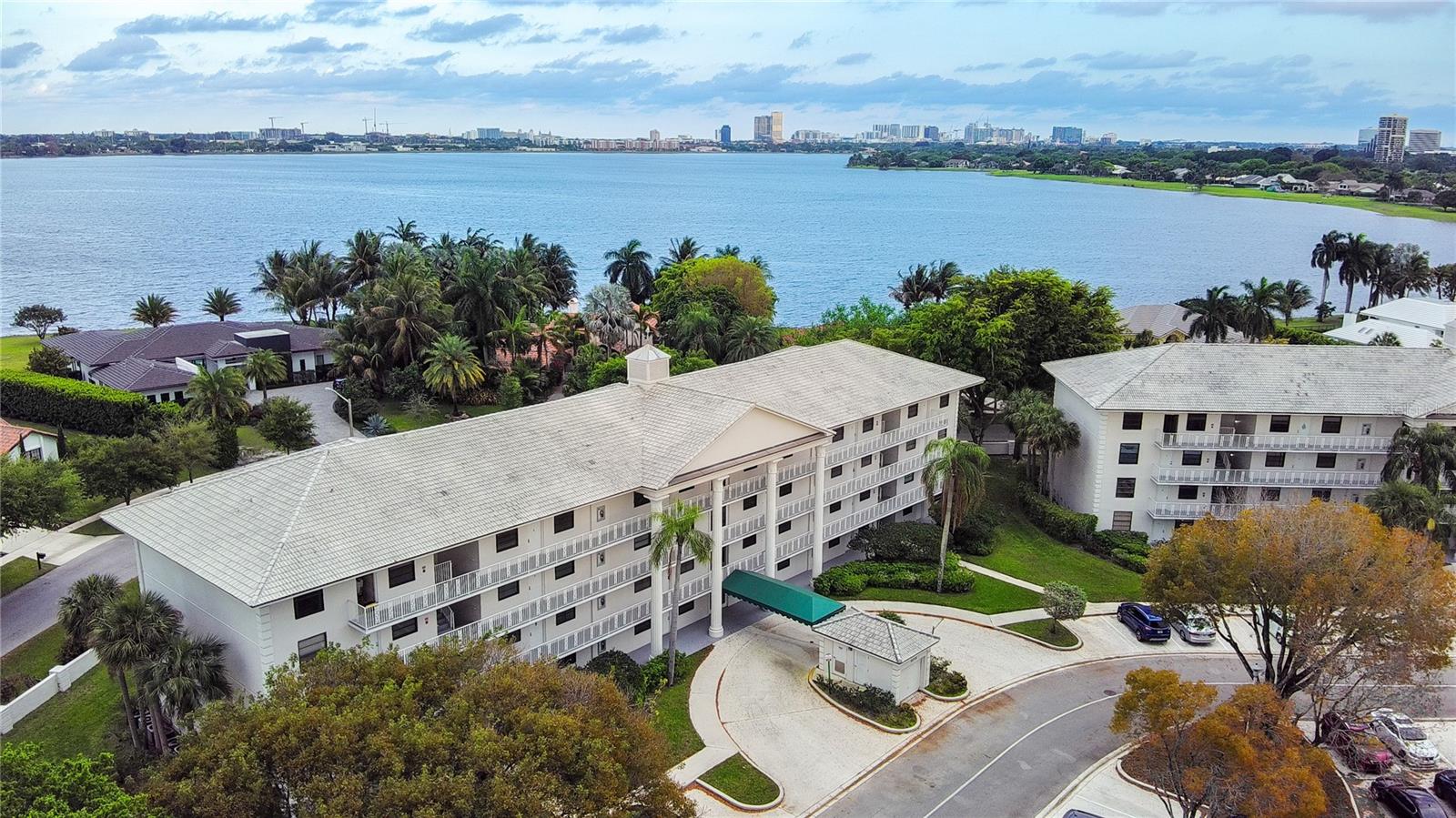 Experience elevated living in this beautifully renovated top-floor residence located in the highly desirable Whitehall community in West Palm Beach. This rare unit offers ultimate privacy with no neighbors above or on either side, creating a quiet and exclusive living environment that is hard to find.    This move-in ready apartment showcases high-end finishes, thoughtful design, and abundant natural light thanks to its east and west exposure. The expansive living area is designed for versatility and comfort, seamlessly accommodating four distinct spaces: a TV lounge, conversation area, dining room, and a stylish bar for entertaining.    The home features two spacious bedrooms, including a luxurious primary suite with a large custom-designed walk-in closet and a beautifully updated private bathroom with glass mosaic details and a modern glass-enclosed shower.    A standout feature is the extended laundry area with brand-new washer and dryer, where the additional space has been thoughtfully converted into a third bedroom or private office, offering flexibility for today’s lifestyle.    Throughout the residence, you’ll find 48” x 48” Italian porcelain tile flooring, smooth walls with premium paint, and modern ceiling fans and lighting fixtures with retractable blades and remote controls. The living room is enhanced with both blackout curtains for optimal media enjoyment and sheer voile curtains that allow soft, natural light to flow in.    The contemporary kitchen is designed to impress, featuring quartz counter tops, a sleek dark gray finish, and top-of-the-line Samsung appliances, including a 5-burner stove and microwave, along with a premium Sub-Zero French door refrigerator with internal water dispenser and ice maker.    This property also offers significant long-term value and peace of mind with impact-resistant windows, a new roof, which can contribute to lower insurance costs for the new owner.    This residence provides convenient access to major highways, shopping, dining, and is just minutes from downtown West Palm Beach and pristine beaches.    This is a rare opportunity to own a fully upgraded, private top-floor unit in a prime location. Schedule your private showing today.
