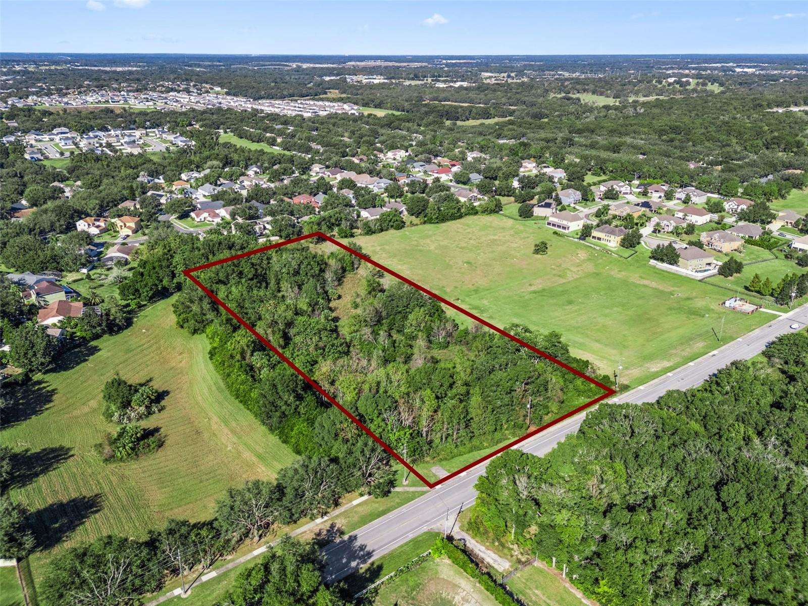 Outstanding opportunity to own nearly 5 acres (4.77 acres) in the rapidly growing Kelly Park / SR 429 corridor of Apopka — one of Central Florida’s most active expansion areas. Zoned RCE (Residential Country Estate), this property offers excellent potential for a private estate, small residential project, or long-term investment. Future Land Use allows up to 3.5 units per acre, and the parcel may be split once, subject to buyer verification.

Positioned along Vick Road with utilities nearby and convenient access to SR 429, SR 441, and SR 46, the property is surrounded by continued residential growth, including Kelly Park Crossings, Wyld Oaks, and other expanding communities.

The land features mature trees and multiple potential homesites, with ample space for a custom home, private driveway, pool, guest house, or additional structures. No HOA provides added flexibility.

Enjoy close proximity to Kelly Park, Wekiva Springs, and Rock Springs Run, along with easy access to shopping, dining, and everyday conveniences.