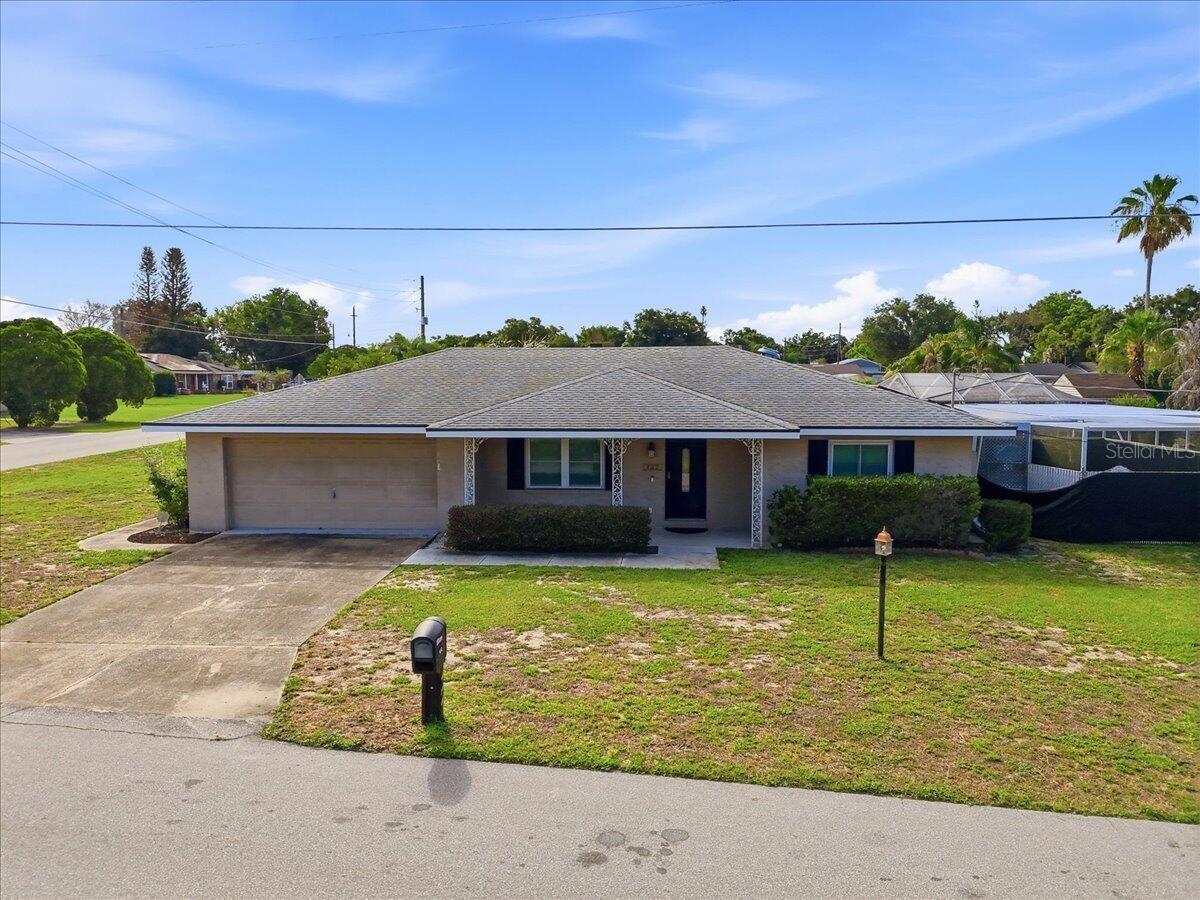 This 2-bedroom, 2-bathroom home features a private, screened-in backyard pool. Enjoy nearly non-existent electric bills thanks to a fully paid-off SolarEdge solar system, complemented by a whole-house 22 kW Generac generator with a 250-gallon propane tank, hurricane-rated windows, a 5-year-old architectural shingle roof, and a Rinnai tankless water heater. The spacious interior boasts a large galley kitchen with stainless steel appliances and a gas stove, a convenient indoor laundry room with extra storage, a 2-car garage, and a versatile 16x12 climate-controlled Florida room. This property has been an Airbnb and can be purchased fully furnished, making it a turnkey investment or a move-in-ready retreat!