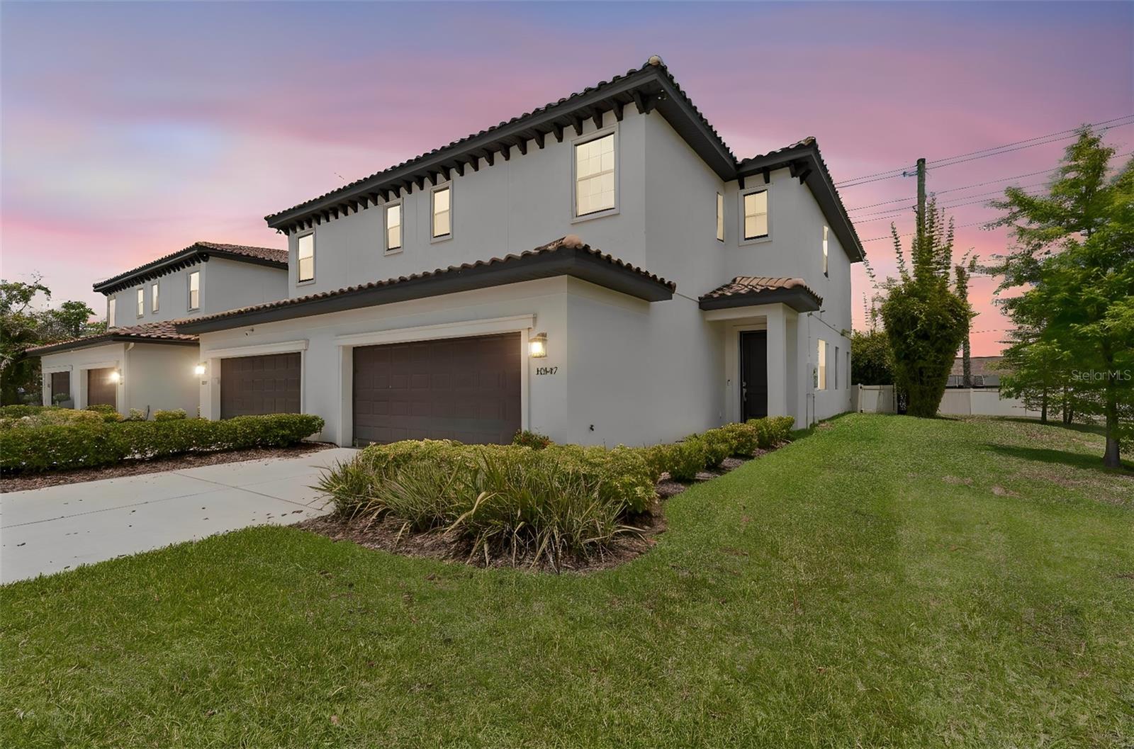 Welcome to The Sanctuary at Carrollwood, an exclusive gated Mediterranean townhome community. This stunning end-unit 3-bed, 2.5-bath residence offers 2,397 sq ft of thoughtfully designed living space, featuring lofty 10-ft ceilings, rich hardwood flooring, and a seamless open-concept layout.   The kitchen is a chef's dream, appointed with 42" cabinetry, granite countertops, a ceramic tile backsplash, stainless steel appliances, ample pantry storage, and a generously sized island — perfect for entertaining.
Upstairs, the primary suite is a true retreat, complete with a generous custom walk-in closet and a spacious ensuite bath. Two additional bright and inviting guest bedrooms each with their own private closet, while a large full bath and convenient laundry room round out the upper level.
Step outside to a screened-in patio overlooking a fully fenced backyard — perfect for relaxing or entertaining in privacy. An attached 2-car garage completes this exceptional home