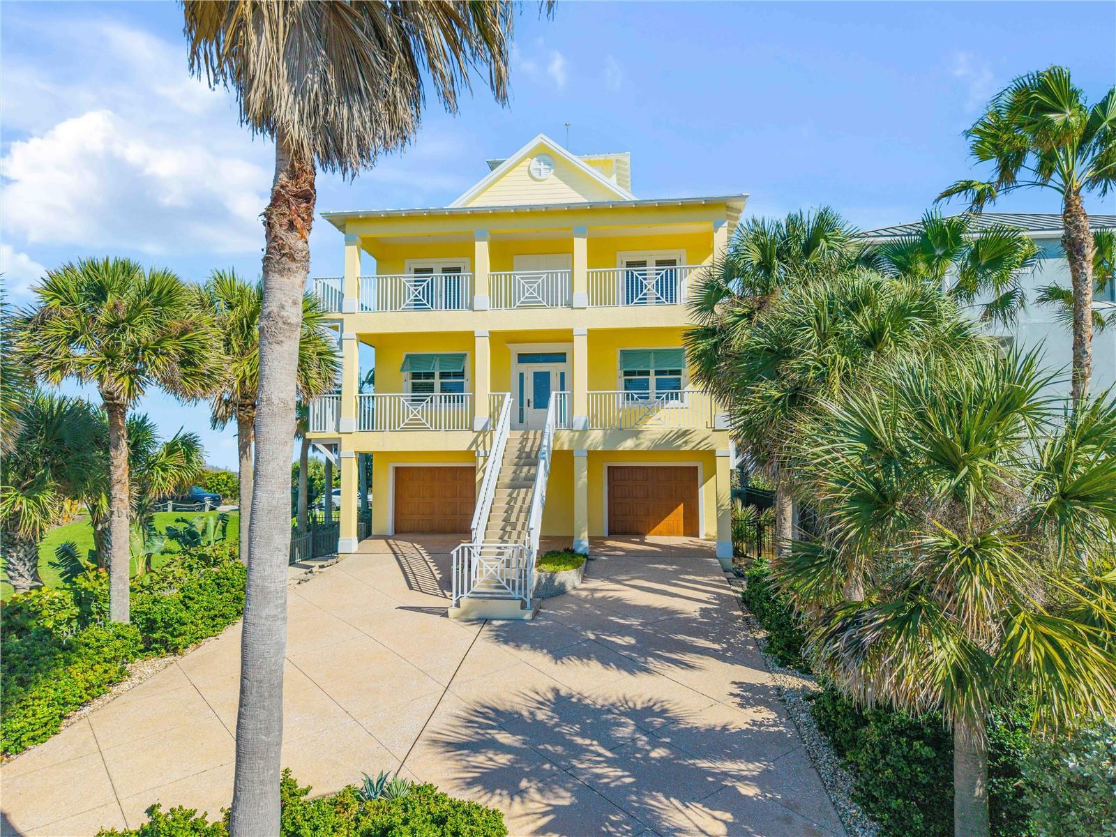 Experience elevated coastal living at 6101 Turtlemound, a luxury beachside retreat in sought-after New Smyrna Beach offering private walk-over access to the Atlantic Ocean. Built with poured concrete construction on all three floors, this exceptional 5-bedroom, 5-bathroom residence delivers durability, elegance, and effortless beachside living. Enjoy sweeping ocean views from both the primary suite and a guest bedroom. Inside, premium finishes set the tone, including wood floors throughout, multi-piece custom moldings, and tongue-and-groove ceiling accents. The home is anchored by a chef’s kitchen, ideal for entertaining after long days on the sand. A standout 16’ x 28’ bunk room with kitchenette and full bath offers exceptional flexibility for guests or multi-generational living. Additional highlights include a balcony pool, crow’s nest with elevated coastal views, and an elevator providing convenient access to every level. Thoughtful oversized fully air-conditioned 2-car garage, a propane tankless water heater, central vacuum system, and an oceanside storage room perfect for easy beach cleanup. Whether you’re watching dolphins from the wrap-around porches or enjoying sunsets over the Indian River from the west-facing decks, this home offers a rare, breathtaking perspective of Florida’s natural beauty. Perfectly located along Turtlemound Road, you’re minutes from pristine beaches, dining, shopping, and the relaxed charm of New Smyrna Beach. Vacant lot to the north is available
 MLS #NS1086393   Schedule your private showing today and experience coastal living at its finest.