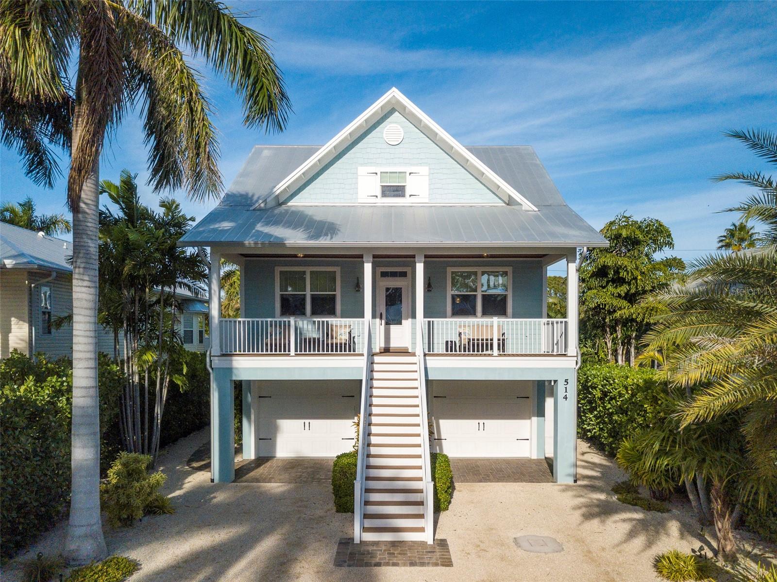 Welcome to your custom-built beach retreat, a testament to exquisite craftsmanship and coastal elegance, curated by the renowned award-winning builder, Ross Built Custom Homes—one of Florida's top custom home artisans. This exceptional residence sets itself apart with meticulous attention to details that elevate its allure, featuring solid wood interior doors adorned with opulent bronze and crystal hardware, along with an array of premium accents—elegant extra-wide crown molding, baseboards, window and door casings, stylish window muntin detail, tongue & groove walls, and inviting wood flooring throughout. The flexible den/office makes this spacious home live like a 4-bedroom if needed. Beautifully furnished and outfitted for you to move right in and begin living the Florida lifestyle. The expansive Great Room welcomes you with comfort and charm, offering a perfect space to gather, unwind, and entertain. A charming half-bath, adorned with timeless penny tile floors, discreetly adjoins the room for added convenience. At the heart of this coastal haven is the chef's dream kitchen-featuring 42-inch solid wood KraftMaid cabinetry, equipped with convenient slide-outs and a generously sized closet pantry, harmonizing flawlessly with sleek quartz countertops. The seamless continuation of wood flooring into the dining room creates an inviting ambiance that perfectly complements the stylish design. Retreat into the spa-like bathrooms adorned with exquisite solid wood cabinetry and luxurious walk-in spa showers, inviting you to unwind in a serene oasis of relaxation and rejuvenation. You will indulge in outdoor living at its finest with expansive front and back porches boasting all-weather composite decking, welded aluminum railings, and stunning wood tongue & groove ceilings. Enjoy the gentle sea breeze while savoring moments of tranquility and sounds of island life. Your private sanctuary awaits outdoors—a resort-style heated saltwater pool beckons, complete with a swim-up sitting spot and sun shelf. Encircled by ample paver areas, immerse yourself in the lush tropical greenery that envelops this haven, ensuring absolute privacy and serenity. Professional landscape lighting adds to the ambiance of this personal oasis for your enjoyment long into the evening hours. Nestled within Anna Maria Island's coveted "North End," this haven places you moments away from the pristine gulf and bayside beaches, easily accessible by a leisurely stroll in either direction. Nearby, The Center of Anna Maria offers a hub for community engagement with wellness programs for all ages. Just a short block away lies Pine Avenue, adorned with shops and eateries exuding an Old Florida charm, alongside the historic Anna Maria City pier. Getting around the island is effortless, whether by foot, bike, golf cart, or the complimentary Island-wide trolley that traverses the length of the island. Escape to this coastal paradise—a meticulously designed home offering unparalleled comfort, refined style, and the quintessential haven for exquisite seaside living. Ideal for your own personal retreat or an outstanding investment property.