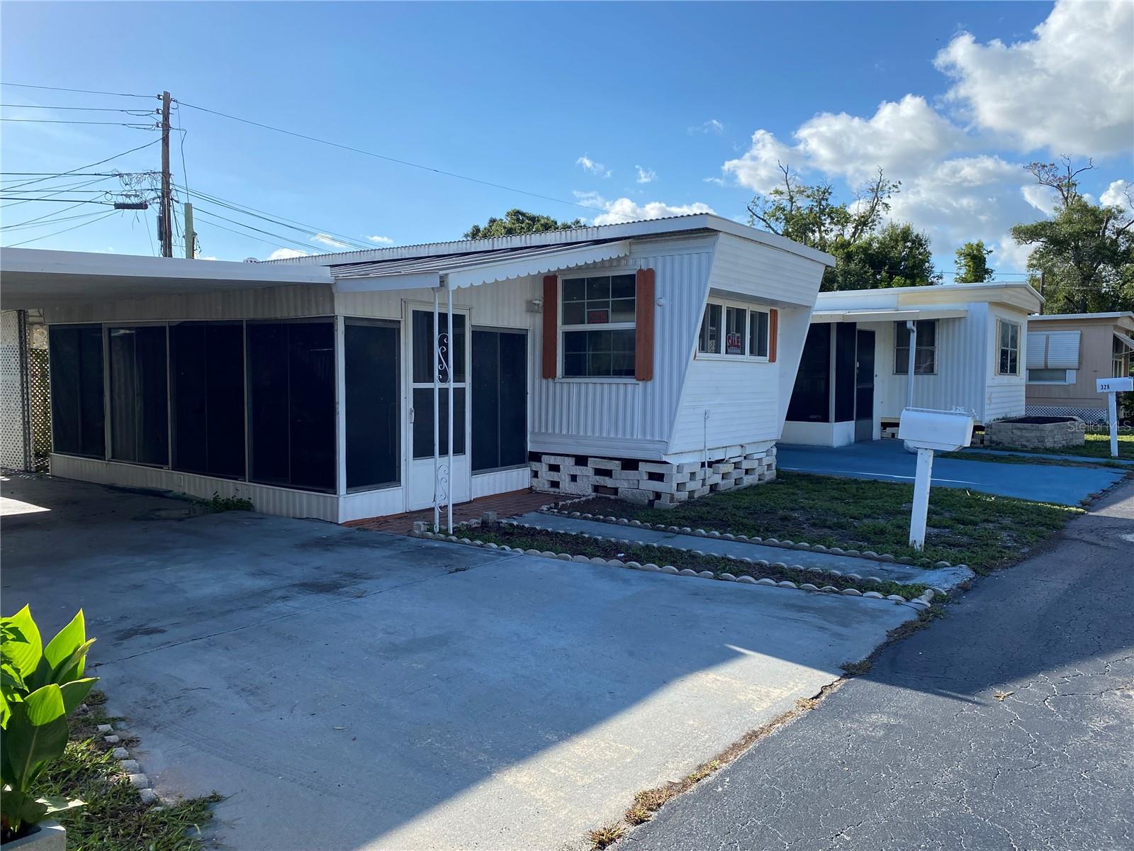 quant mobile home waiting for your personal touches. You will own your share with this low listed price and your monthly fee of $150 p/m.  This 1 Bedroom, 1 Bath with an extra size enclosed porch and partial screen room   Only a short 15-minute drive to downtown St. Pete, the beaches and Gulfport make this the perfect place to call home where you can grill and grow your herbal garden is in a charming, 55+ community close to lots of park's shopping, beaches, and downtown St Petersburg.