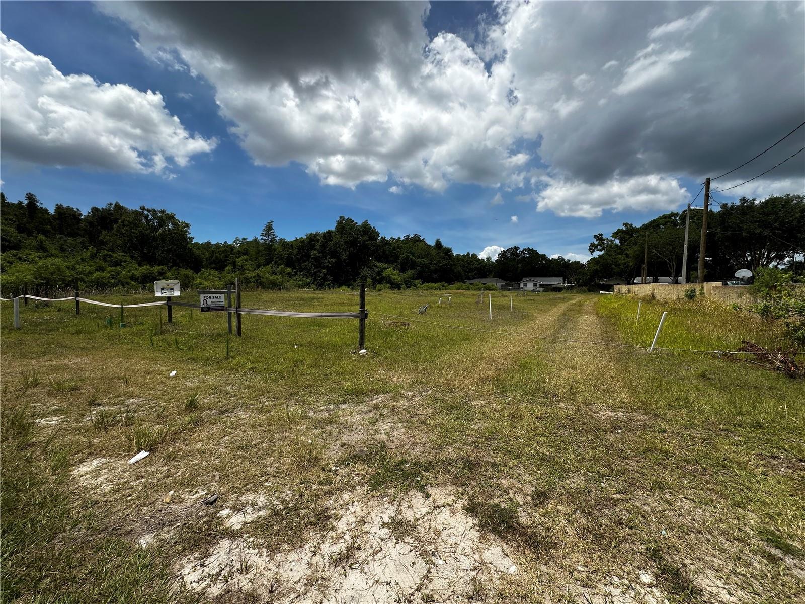 Centrally located between Carrollwood, Town n' Country and Citrus Park across from The Villas at Newport Landing, you can't beat THIS location!! This lot is all dry, flat land (226'x330') with two retention ponds, totaling 1.68 acres (73,181sqft), flood zone X and zoned PD. Price is firm.