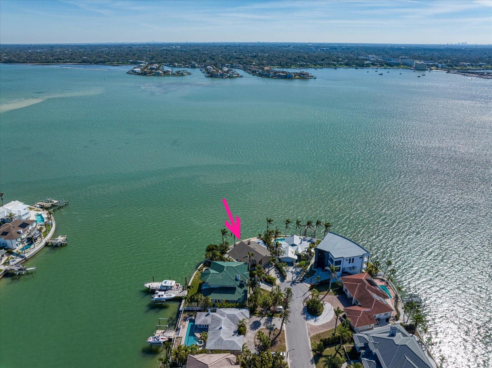 Welcome to waterfront living at its finest in Belleair Beach! Positioned high and dry during Hurricane Helene, this exceptional property offers 119 feet of unobstructed deep-water frontage—perfect for boating enthusiasts with direct Gulf access. The unique lot placement ensures the dock is set to the side, preserving panoramic views of the Intracoastal Waterway from nearly every room.

This beautifully updated 2-bedroom, 3-bathroom home (currently configured as 2 bedrooms + den that could be converted back to a 3rd bedroom) boasts a spacious 2,679 sq. ft. layout on a private, oversized lot. Inside, enjoy a light-filled open floor plan with ceramic tile flooring, a wood-burning fireplace, and expansive windows framing tranquil water views. The chef’s kitchen features Corian countertops, Fisher Paykel drawer dishwasher, reverse osmosis drinking water filtration, and seamless flow into the dining and living spaces—ideal for entertaining.

Retreat to your private backyard oasis, complete with a heated pool and spa (refinished with durable fiberglass), SunSetter awnings, and a fully renovated patio with sun-filtering shades and plantation shutters for ultimate comfort. The north zone HVAC system was fully replaced in 2023, and the roof was redone in 2018, ensuring peace of mind.

Waterfront highlights include a grandfathered dock replacement opportunity, providing flexibility for future upgrades. Enjoy serene mornings spotting dolphins, evening fireworks on the horizon, and the privacy that comes with a prime cul-de-sac location.

Residents of Belleair Beach enjoy private beach access, parks, tennis courts, and the relaxed charm of this coveted Gulf Coast community—all while being just minutes from top dining, shopping, and entertainment.

If you’re looking for privacy, panoramic water views, and endless potential, this is the home for you.