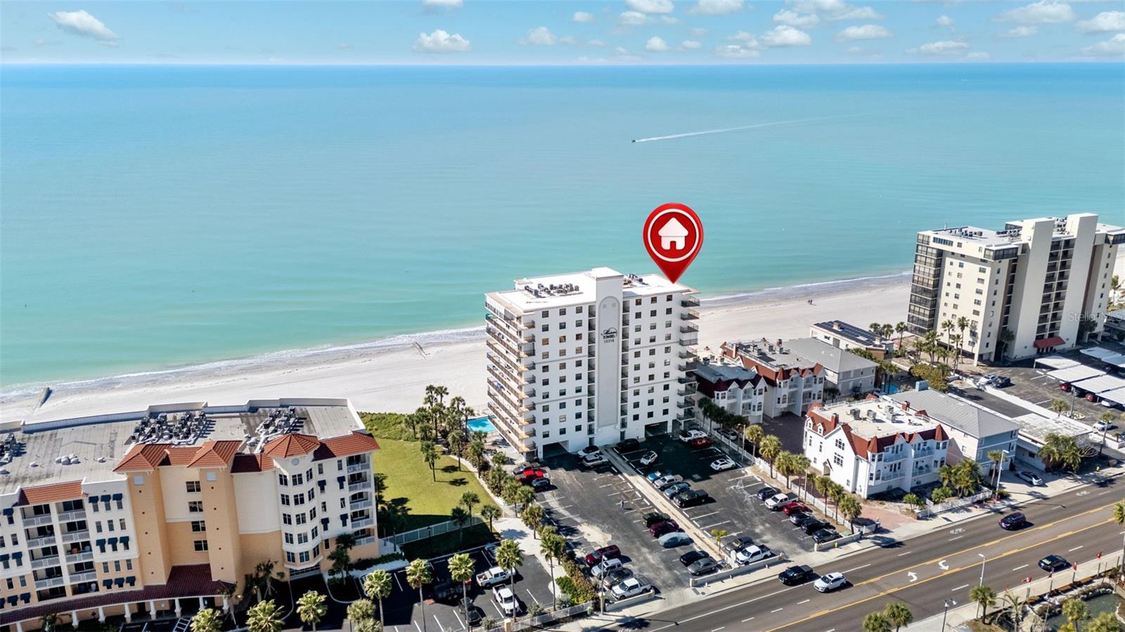 Indulge in refined beachfront living in Madeira Beach, where the soothing cadence of the Gulf sets a serene backdrop for everyday life. This thoughtfully designed residence offers an open-concept layout ideal for both relaxed living and elegant entertaining, with sunrise coffees and sunset cocktails framed by ever-changing coastal skies. The gourmet kitchen showcases Whirlpool stainless steel appliances and striking granite countertops that continue seamlessly into the backsplash, creating a polished, cohesive aesthetic. Notable enhancements include a new air conditioner (2023), high-end ceiling fans, blackout shades throughout for optimal comfort, and a custom Murphy bed cabinet in the living room that blends function with warm design. The residence is offered turnkey and furnished, enabling an effortless transition to beachfront living. The building has undergone extensive improvements, including a newly painted exterior, a newer roof (2019), upgraded pavers, a renovated pool, and a beautifully updated lobby, with remaining exterior enhancements nearing completion. Ideally positioned just beyond the busiest stretches of the beach, this home offers effortless access to dining and everyday conveniences—an exceptional opportunity for a primary residence, second home, or investment along Florida’s Gulf Coast.