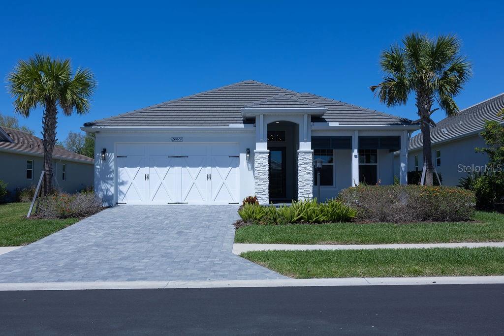One or more photo(s) has been virtually staged. Welcome to 8100 Slipway Dr, Sarasota, FL 34240, where luxury, comfort, and peace of mind come together in one exceptional Florida home. Nestled in Waterside – Lakehouse Cove community, this beautifully upgraded residence offers the perfect blend of modern elegance and everyday functionality.
Step inside and experience an open, light-filled floor plan enhanced by custom lighting that creates a warm, sophisticated ambiance throughout. The gourmet kitchen and living spaces flow seamlessly, making this home ideal for entertaining or relaxed Florida living.
Retreat to your private outdoor oasis featuring a heated pool and spa, perfect for year-round enjoyment. Whether hosting guests or enjoying a quiet evening under the stars, this space delivers the ultimate Florida lifestyle.
A versatile bonus office or den provides the perfect space for working from home, a quiet retreat, or even a flex room to suit your lifestyle needs.
This home is thoughtfully equipped with hurricane impact doors and windows, providing security and energy efficiency. A whole house Generac generator ensures uninterrupted comfort, giving you confidence and convenience during any season.
The spacious 3-car garage offers ample room for vehicles, storage, and even a golf cart, adding both convenience and flexibility to your daily living.
The custom-designed primary closet adds a touch of luxury and organization to your daily routine, while every detail of this home reflects quality craftsmanship and attention to detail.
Located in Sarasota, FL, near Lakewood Ranch, top-rated schools, shopping, dining, and Gulf Coast beaches, this property is ideal for buyers seeking a luxury home in Sarasota, a pool home in Sarasota FL, or a move-in-ready Florida dream home.
Do not miss this opportunity to own a stunning Sarasota pool home with premium upgrades in one of the area’s most sought-after locations.