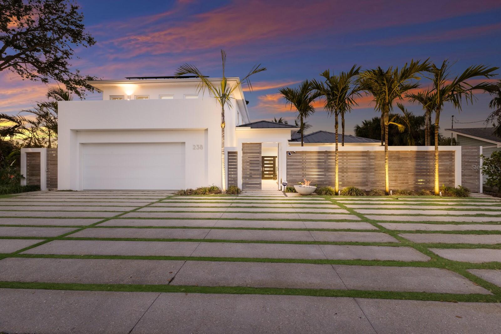 Welcome to your dream island retreat, perfectly nestled in the heart of Siesta Key’s Palm Island, just minutes away from the world-famous Siesta Beach and vibrant Siesta Village. This beautifully renovated 4-bedroom, 4-bathroom home is the epitome of coastal luxury, offering the ultimate island lifestyle where you can enjoy sun, sand, and all the amenities of this exclusive locale. Meticulously transformed by the renowned Nautilus Homes, this home boasts an open floor plan with soaring high ceilings, making it the perfect space for both relaxation and entertaining. Every inch of the property has been updated with the finest finishes and state-of-the-art features, including: 
Gourmet Kitchen with new appliances, Impact-Resistant Windows for peace of mind, New 17KW Solar System with backup generator, keeping your electric bill at an incredibly low $20-$30  month, New Boat Lift Motors and a private dock, perfect for boating enthusiasts, 
Saltwater Pool System and spa, enclosed in a serene, waterside cage for privacy, Custom Treehouse for a fun and unique retreat, Whole House Water Conditioner and new water heater, Two New A/C Units ensuring year-round comfort and a Xeroflood water barrier system has been installed.  Natural light pours into every room, highlighting the spacious living areas and creating an inviting atmosphere throughout. The sumptuous Primary Suite offers a private sanctuary, featuring views of the lush tropical surroundings. Step outside to your own private oasis where you can unwind by the pool, entertain in style, or take your boat out for a sunset cruise – all right in your backyard. With Siesta Key's famous restaurants, shops, and nightlife just moments away, you’ll have everything you need to experience the best of island living. This is a rare opportunity to own a piece of paradise on Palm Island, where the ultimate lifestyle meets extraordinary design and function.