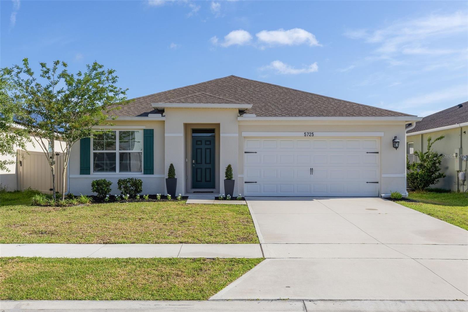 Experience the perfect blend of comfort, style, and convenience in this immaculate, like-new 2023 DR Horton built home featuring 3 bedrooms, 2 bathrooms, a spacious fenced backyard, and no rear neighbors. Relax and unwind while enjoying serene water views from your screened lanai, offering the perfect backdrop for morning coffee or evening gatherings.

The thoughtfully designed open-concept floor plan seamlessly connects the great room, dining area, and kitchen, creating an inviting space for both everyday living and entertaining. Beautiful 18-inch tile flooring flows throughout the main living areas, while energy-efficient windows and sliding glass doors help keep utility costs low. Smart home technology and durable block-and-stucco construction provide modern convenience and lasting peace of mind.

The stunning kitchen is the heart of the home, featuring granite countertops, a stylish backsplash, stainless steel appliances, an upgraded Bosch dishwasher, abundant cabinetry, generous counter space, and upgraded hardware throughout.

Retreat to the spacious primary suite, complete with a walk-in closet and an elegant en-suite bath featuring dual granite-topped vanities and a custom tiled walk-in shower with a tempered glass enclosure. Additional upgrades include gutters, a whole-yard irrigation system, 100% roof coverage, fresh St. Augustine sod, and beautifully refreshed landscaping.

The home also comes with a 100% coverage for the roof, gutters and whole yard irrigation system. termite bond and security system. 

Ideally located in the Suncrest community, residents enjoy easy access to Lake Nona, Narcoossee Road, the Medical City corridor, Orlando International Airport, and an abundance of shopping, dining, and entertainment options. Community amenities include a resort-style pool with cabanas, adding to the exceptional Florida lifestyle this neighborhood offers.

This move-in ready home truly has it all—welcome home!