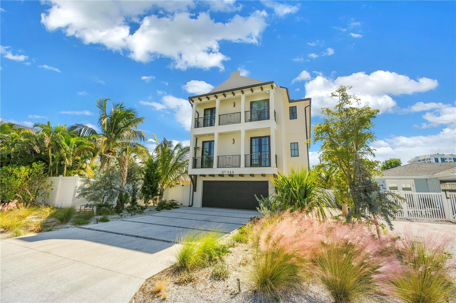 Discover the best of coastal living on Lido Key. This 6 bedroom, 6.5 bath coastal retreat blends modern beach elegance with generous indoor and outdoor spaces designed for relaxation and entertainment.
Step inside to an open, sun-filled layout finished in soft coastal tones and contemporary style. An in-home elevator provides convenient access throughout. Each of the six bedrooms features its own en-suite bath for comfortable hosting. The main living area flows into a well-appointed kitchen with premium appliances, custom cabinetry, and a spacious island ideal for gathering.
Balconies and a rooftop deck offer stunning Gulf views, creating inviting spots to enjoy morning coffee or sunset skies.
Outside, a private pool area welcomes year-round fun with a heated pool, spa, and waterslide. Additional outdoor highlights include an outdoor shower and covered entertainment space, perfect for relaxing after the beach or spending time with friends and family.
With 3,279 heated square feet, this home delivers a comfortable balance of coastal charm and modern convenience. Ideally located near sugar-sand beaches, boutique shopping, and dining on Lido Key and St. Armands Circle, this residence offers the option to enjoy full-time living or utilize as a luxury rental.
The elevated coastal lifestyle awaits.