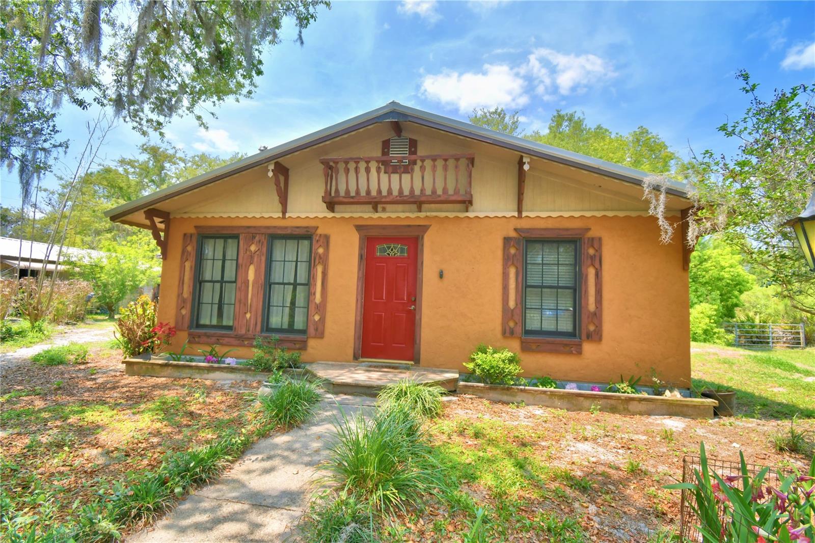 This is the one you've been looking for! Beautiful cozy ranch cottage nestled at the end of a long privately gated driveway and seated on 3.66 acres! Here's the best part included in the sell of this home is an additional adjacent parcel of 3.66 acres zoned residential allowing for the future potential of an additional home with it's own private driveway. Adjacent Parcel: 27-32-04-932514-000130.  Both parcels combine to a total of 7.32 acres.
  This amazing homestead is immaculately cared for with a brand new roof and central heat pump installed just last year. This property has so many great features to offer including a very large barn with storage rooms and space for a workshop as well as animal pens and shelter for your livestock. 
Come make this one your own family compound!