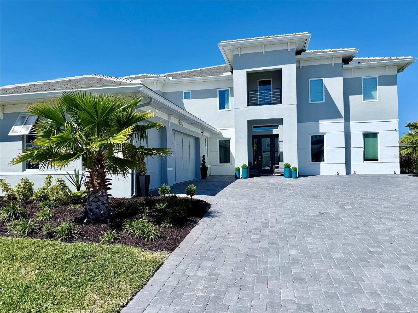 NEW CONSTRUCTION, Fully Decorated like "MODEL HOME", READY TO MOVE, great location, 1.7 miles Downtown  Windermere 6.5  miles Dr Phillips, 3.2 miles to Winter Garden Village 6 miles from Winter Garden Farmers Market, 12 miles to Disney,  prestigious gated community of only 34 residences. offering the perfect balance of privacy and accessibility. The home itself effortlessly blends contemporary design with elegant modern coastal style, offering a true sense of exclusivity.
2 luxurious master suites, each featuring custom-designed built-in furniture and wallpaper that not only enhance the home's personality but also maximize functionality. The master suites offer an unparalleled level of comfort and privacy, with one located on the first floor and the other on the second floor, both featuring spacious "his-and-hers" walk-in closets.
The home is fully smart, controlled by both app and voice commands, providing convenience and modern living at the touch of a button.
Designed with an active lifestyle in mind, the home includes a state-of-the-art private gym, perfect for daily workouts or unwinding after a busy day.
Step outside into your very own oasis — a meticulously crafted outdoor living area that includes a gourmet kitchen with a pizza oven, ideal for entertaining guests. The rare lap pool is a standout feature, catering to both swimming enthusiasts and those who simply wish to unwind in luxury.
Other exceptional features include a spacious three-car garage and a generous driveway, providing ample space for hosting gatherings, special events, or simply relaxing with family and friends.
With every detail thoughtfully considered, this home offers not just a place to live, but an elevated lifestyle.