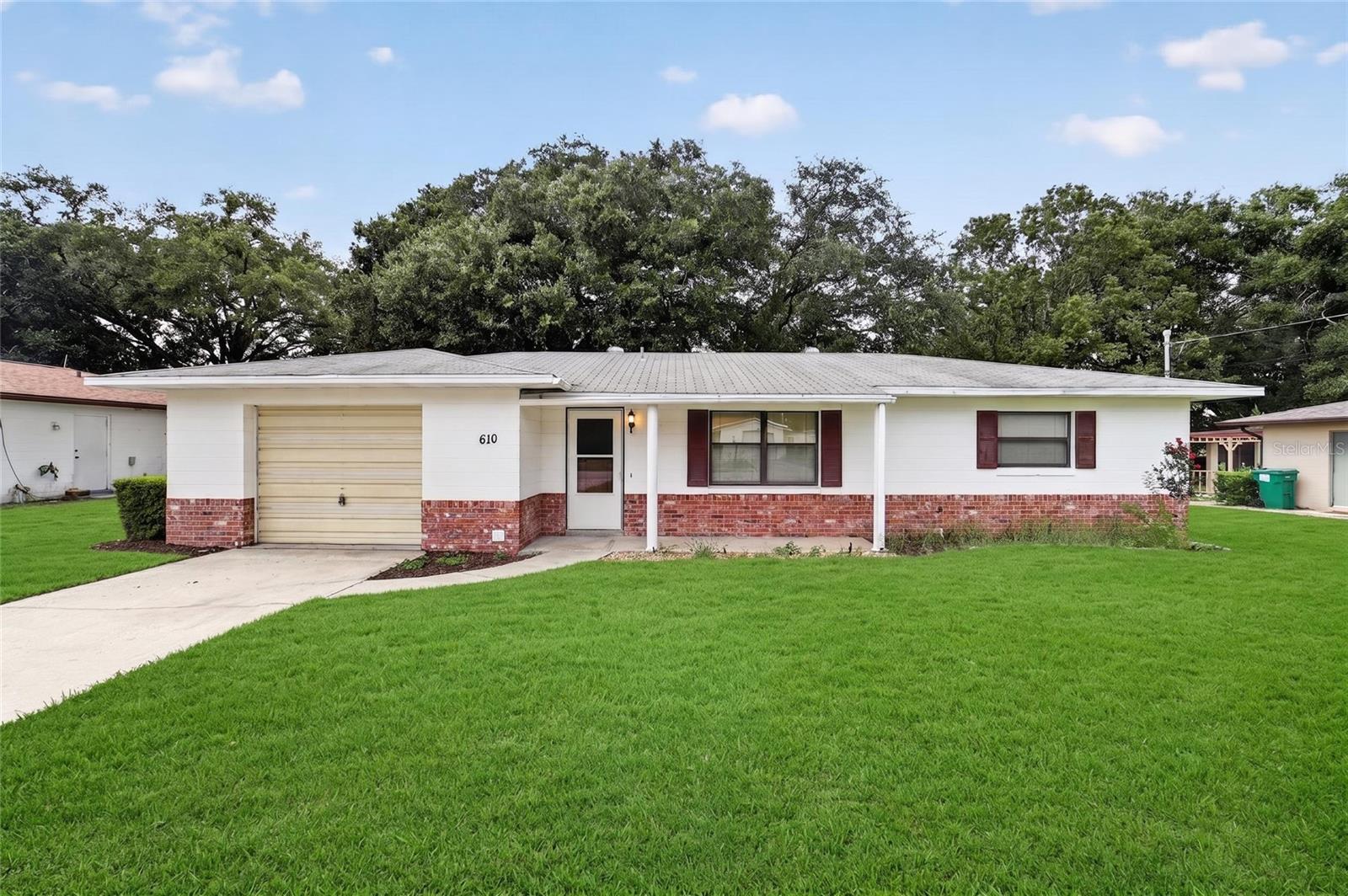 UNBEATABLE LADY LAKE LOCATION! 2BR/2BA Gem in Quiet, Established Neighborhood – Close to Harris Chain of Lakes with No HOA! Stop spending hours in traffic and start enjoying the perfect Central Florida lifestyle! Nestled in a peaceful, quiet, and established Lady Lake neighborhood with mature trees and no HOA, this solid 2-bedroom, 2-bathroom home with a 1-car garage is the ultimate launching pad for work and play. Enjoy an incredibly quick, stress-free drive into the heart of The Villages for dining and shopping, a direct 1-hour commute to Western Orlando, and weekends spent on the water with the beautiful Harris Chain of Lakes just minutes from your front door! A true outdoor lover's dream, this property features an incredible oversized backyard and dedicated, unrestricted space for your RV and boat parking—allowing you to keep all of your recreational gear safely on-site without any costly storage fees or nosey HOA rules. Tailored to fit your goals: First-Time Buyers: Stop paying rent! This solid, functional home is your chance to build instant sweat equity by bringing your own design ideas and minor cosmetic updates in a lovely, long-standing community. Retired Looking to Downsize: Enjoy peaceful, single-level living in a serene, established neighborhood with a massive yard for pets, gardening, or outdoor relaxation—plus unparalleled access to local golf and dining. Savvy Investors: Capitalize on an exceptionally strong, high-demand commuter rental market. Tenant demand is naturally high in quiet, safe, and established neighborhoods with no HOA restrictions. Affordable homes in Lady Lake with this size lot, parking freedom, and stellar location are practically extinct. This property is priced for immediate action and will be sold quickly. Schedule your tour today and beat the rush!