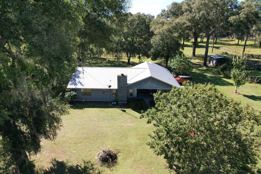 One or more photo(s) has been virtually staged. Beautiful property located minutes from Equestrian Center, to be precise property is across from Shalom Park. This property has many possibilities, can be developed or just upgrade what is already here. Home features 3-bedroom 2 bath, 2 car garage that was enclosed but can be re-opened for proper use. Wood burning fireplace with brick.   Home also has an open front porch that lets you contemplate the beautiful nature.   barn with stalls incorporated for feeding and stabling field horses. This property is divided into multiple fields and is laid out to handle many horses. , a washroom, feed room, tack room and barn office, two more buildings for equipment storage.  Property is surrounded by two big developments. that mean that this can be also. close to all of the showgrounds, and located within a short drive to all amenities for shopping, groceries, and farm goods. ,