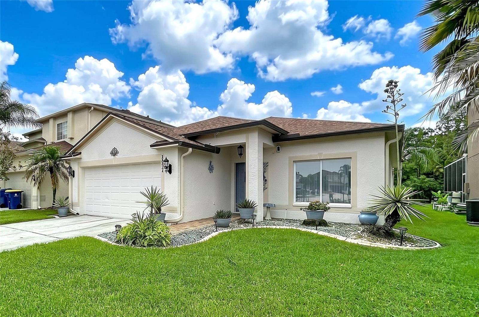 AFFORDALE POOL HOME!  3 Bedroom / 2 Bath with Pond and Conservation Views. This Super Clean Home has a Formal Living and Dining Room with Wood Flooring.  Arched doorways & High Ceilings.  Family Room and the Kitchen Areas join creating a large Gathering Area, perfect for entertaining family & friends.  The Kitchen has full appliance package and Granite Countertops, Decorative Plant Shelves in addition to a Dinette that with a view. The Primary Suite has Wood Laminate Flooring and a Glamour Bath with Walk-In Closet, granite topped vanity, separate commode area & shower.  Split Bedroom plan with an updated secondary Bathroom with beautiful tile and countertops.  The Covered Lanai overlooks the pond and conservation and joins to the pool area for Barbeques and Summer Fun. Landscape Boarders and Swaying Palms. Great New Tampa Location, just minutes from the I-75, I-275 Interchange and all of the Shopping and Restaurants. The Community has a Pool, Tennis and Basketball Courts.