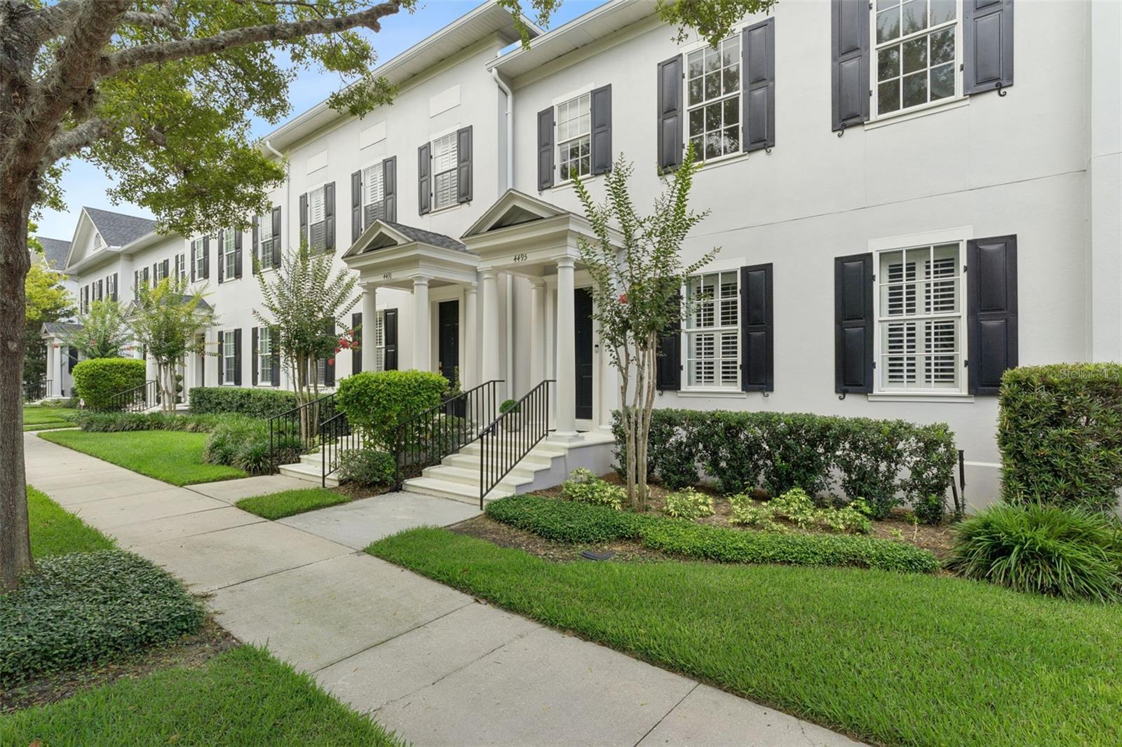 Ideally located on a quiet, tree-lined street with a charming central green space, this home is just a short walk from the shops, restaurants, and vibrant atmosphere of Baldwin Park's Town Center. Enjoy the best of Baldwin Park living with abundant walking and biking trails, nearby parks, and convenient access to Publix, dining, and boutique shopping. Designed for comfortable living and effortless entertaining, this home features an open-concept floor plan with generously sized rooms and a spacious upstairs loft that can easily serve as a fourth bedroom, home office, or flexible living space. The private, fully fenced backyard is beautifully appointed with a paver pathway leading to the garage and low-maintenance, pet-friendly synthetic turf, creating the perfect outdoor retreat. The first-floor primary suite offers a luxurious escape, complete with an oversized walk-in closet featuring a professionally designed organizational system. The en-suite bath includes a relaxing soaking tub, separate walk-in shower, and dual vanities. Secondary bedrooms are exceptionally spacious, including one with a walk-in closet and custom built-in shelving. Plantation shutters adorn all first-floor windows, and crown molding extends throughout the home. Additional updates include a new roof installed in 2025 and a new HVAC system installed in 2023. This exceptional location places you just minutes from Winter Park, Park Avenue, Rollins College, UCF, downtown Orlando, Orlando International Airport, and major highways, offering outstanding accessibility while preserving the charm and sense of community that make Baldwin Park so desirable.