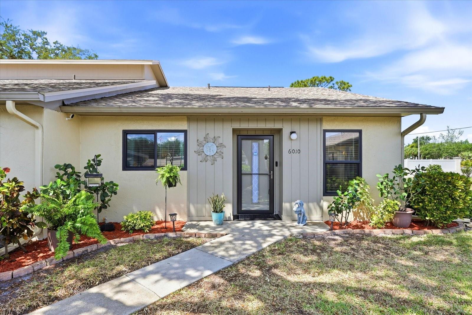 Welcome to Huntington Woods! This beautifully updated 2-bedroom, 2-bathroom condo is a truly a DREAM with nearly every major system having been refreshed in recent years. The exterior was updated in 2023 with new paint, a new roof, and new hurricane-rated windows providing peace of mind. Inside, both bathrooms were completely renovated + a new AC system was installed in 2024. All appliances have been updated since 2021 including the washer and dryer which are in their own laundry room complete with storage. Fresh interior paint throughout ties everything together. This home is truly turnkey! One of the greatest advantages is how little you'll have to worry about after move-in. The monthly condo fee covers cable + internet, trash + recycling, lawn care + irrigation, a community pool, plus building maintenance + insurance! All buildings are single-story with only four condos per building making your home a quiet and peaceful oasis. Your assigned covered parking space keeps your car cool and protected year-round. Being an end-unit, the green space outside feels like your own private yard. The location sits perfectly between downtown Sarasota and downtown Bradenton and is only 11 mi to Florida's beautiful gulf beaches. IMG Academy is only 2.5 miles away and Sarasota/Bradenton International Airport is just 6 mi from your door. Whether you're seeking a full-time residence, a seasonal Florida escape, or an investment in one of the area's most convenient corridors, 6010 28th St W delivers all you can ask for!