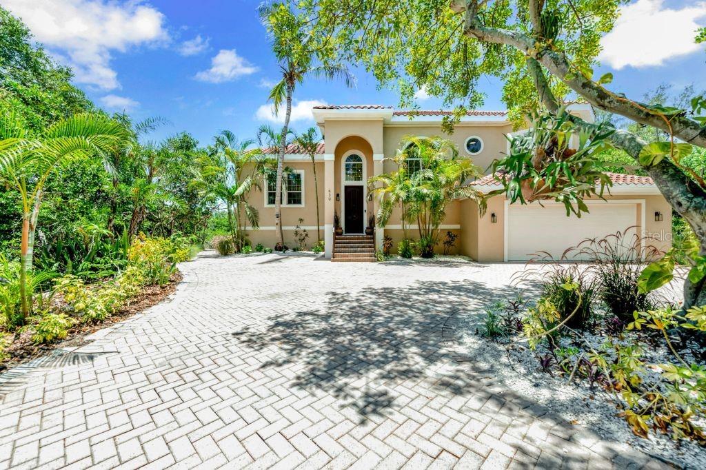 Enjoy absolute privacy with secluded lagoon views from this 4BR/4BA, 3,130+/- sq. ft. move-in ready home inside the exclusive Hideaway Bay community. Soaring double-height spaces, abundant natural light, designer finishes, tennis courts, and smart home technology are just a handful of the amenities you will encounter at this recently renovated residence. Deep water dock for your 30ft+ boat allows easy access to the Gulf and world-famous beaches. There is no time like the present to invest in your future and start your next grand adventure in Longboat Key!
