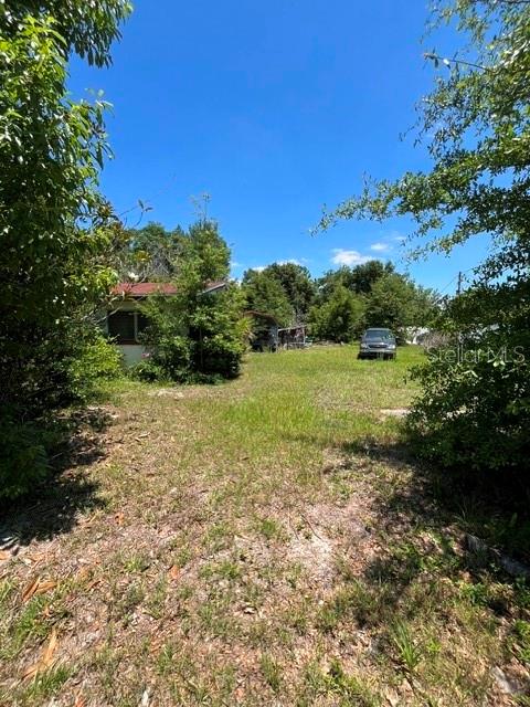 Rare investment opportunity in Apopka featuring 2 single-family lots totaling approximately 0.46 acres offered together for 1 price. The primary lot at 721 S Washington Ave previously had a home on site and already has water and electric in place, creating added value and potential savings for redevelopment. The second adjacent lot is also included, making this an ideal 2-for-1 opportunity for builders, investors, or buyers looking to maximize returns. Zoned single family with recent new construction comps averaging around $400K+, this property offers strong upside potential to build and resell 2 homes or hold as a long-term investment in a growing Central Florida market close to major highways, shopping, dining, and Orlando access.