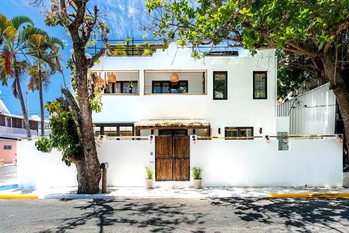 Find your oasis in this boutique one-of-a-kind property. 

Located in Ocean Park this recently renovated property houses 2 apartments totaling 6 bedrooms, 5 full bathrooms, a private pool area, and a large rooftop terrace with a hot tub & an outdoor grill. 

This home boasts impeccable attention to detail with tropical vibrant colors and prints, woodwork and a sleek design. Both apartments are equipped with attractive, modern kitchens and cozy lounge areas. Each kitchen is outfitted with new appliances, full sinks and plenty of counter space. 

The first floor apartment has two queen bedrooms and one bunk room with twin bunk beds. The queen bedrooms have their own private bathrooms with spacious showers. This unit also has another full bathroom located off the main living space.

The second floor unit has two queen bedrooms and one room with two single beds. 

Both the pool terrace and the rooftop have sinks and gas grills. The living rooms feature a sofa and flat-screen Smart TV. The first floor apartment has a light-filled working area right off the living room.

Your private oasis is just steps from one of the most popular beaches in Puerto Rico & walking distance to numerous popular restaurants, bakeries, bars, surf shops & pharmacies / grocery stores. The villa is equipped with everything you'll need!

The property is an income investment opportunity that currently caters to short-term rentals such as Airbnb.