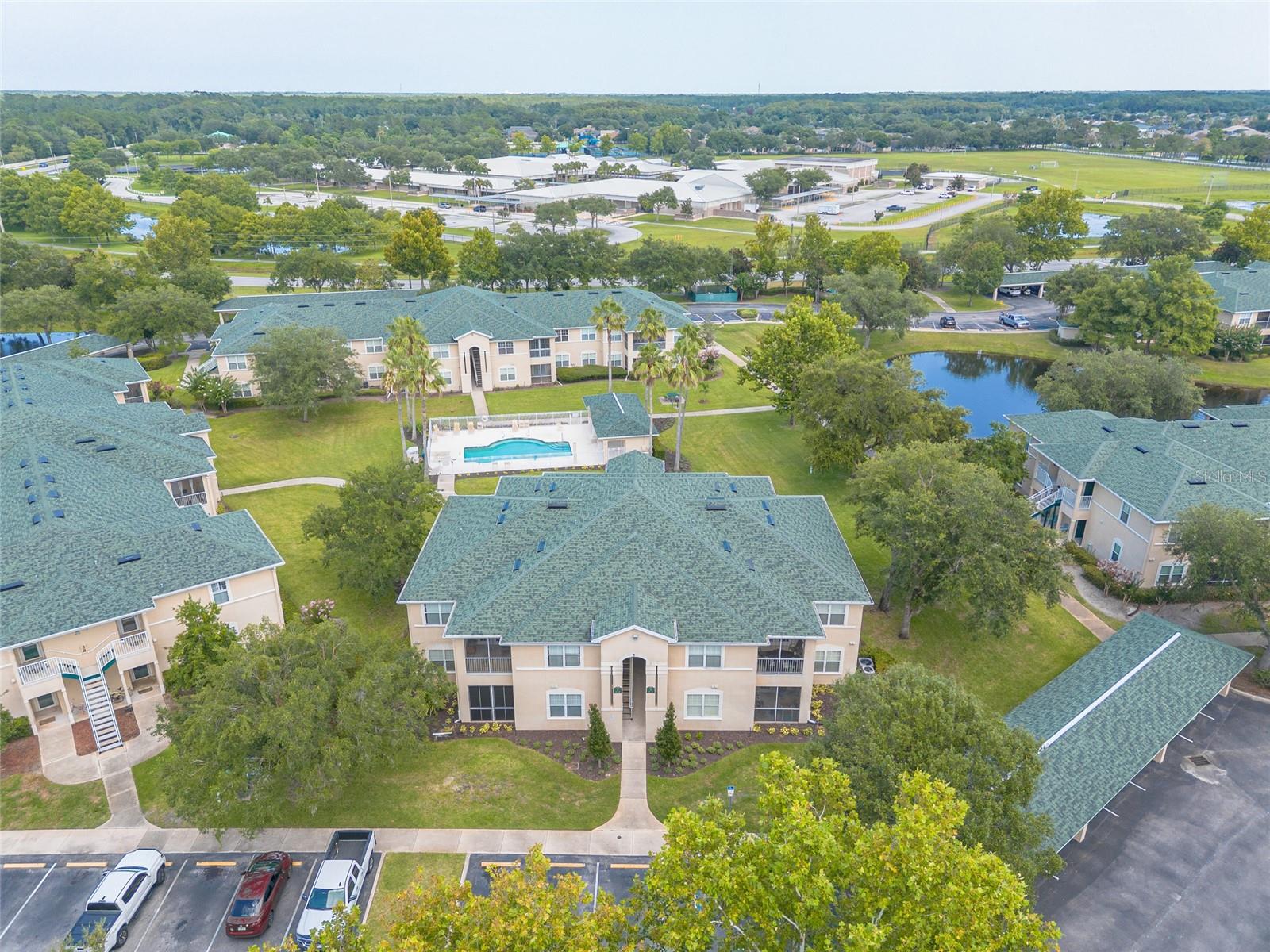 Move right into this beautifully maintained 2-bedroom, 2-bath second-floor condo in the desirable Whispering Woods community in Port Orange. Overlooking the community pool and peaceful green space, this spacious home has been meticulously cared for and is ready for its new owner. The kitchen features stainless steel appliances that are only three years old, along with elegant quartz countertops that continue into both bathrooms for a cohesive, updated look. The spacious primary suite offers a large walk-in closet and a private ensuite bathroom, creating a comfortable retreat at the end of the day. Step outside to the oversized screened balcony, the perfect place to relax with your morning coffee or unwind while enjoying the Florida sunshine, pool views, and peaceful surroundings. The HOA provides exceptional value by covering water, sewer, trash, community pool, exterior building insurance, and common area maintenance, making for easy, low-maintenance living. Conveniently located near I-95, shopping, dining, schools, and just a short drive to the beach, this condo is ideal as a primary residence, vacation getaway, or investment property. All information is intended to be accurate, however not guaranteed.