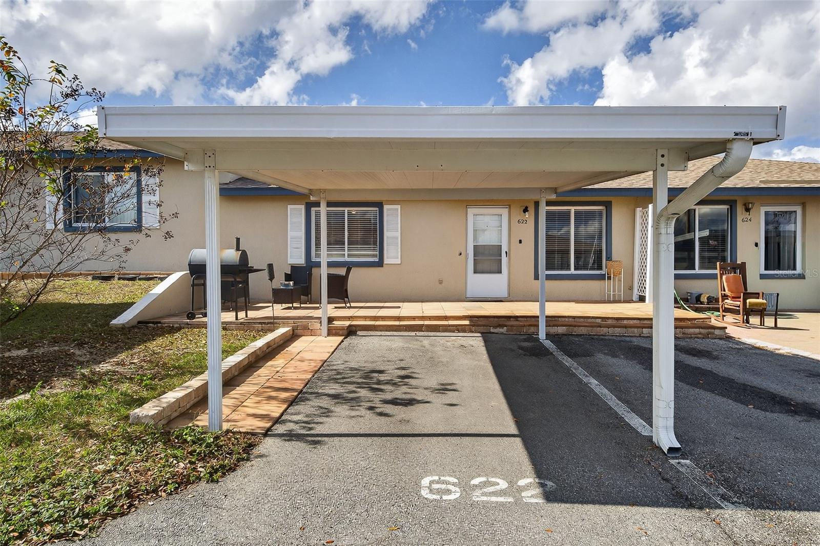Florida Living at Its Best! Welcome home to this beautifully updated 2-bedroom, 2-bath residence offering the perfect combination of comfort, style, and convenience. From the moment you walk through the door, you'll be impressed by the bright, open floor plan, modern finishes, wood-look flooring, and inviting living spaces designed for everyday living and entertaining.

The spacious primary suite serves as a private retreat and features sliding glass doors leading to a screened and covered lanai. A portion of the lanai has been enclosed to create a flexible bonus room—ideal for a home office, reading nook, fitness area, or hobby room.

Step outside to your private tiled patio, the perfect place to enjoy your morning coffee, unwind after a long day, or host family and friends.

This sought-after community offers amenities rarely found at this price point, including assigned covered parking, a sparkling community pool, and direct access to beautiful Lake Smart with a private boat ramp. Whether you enjoy boating, fishing, kayaking, or simply watching the sunset over the water, you'll love the lifestyle this community provides.

Located just minutes from shopping, restaurants, medical facilities, and major roadways, this move-in-ready home offers the convenience buyers are looking for and the Florida lifestyle they dream about.

Opportunities like this don't come along often. Schedule your private tour today and discover why this could be the perfect place to call home.