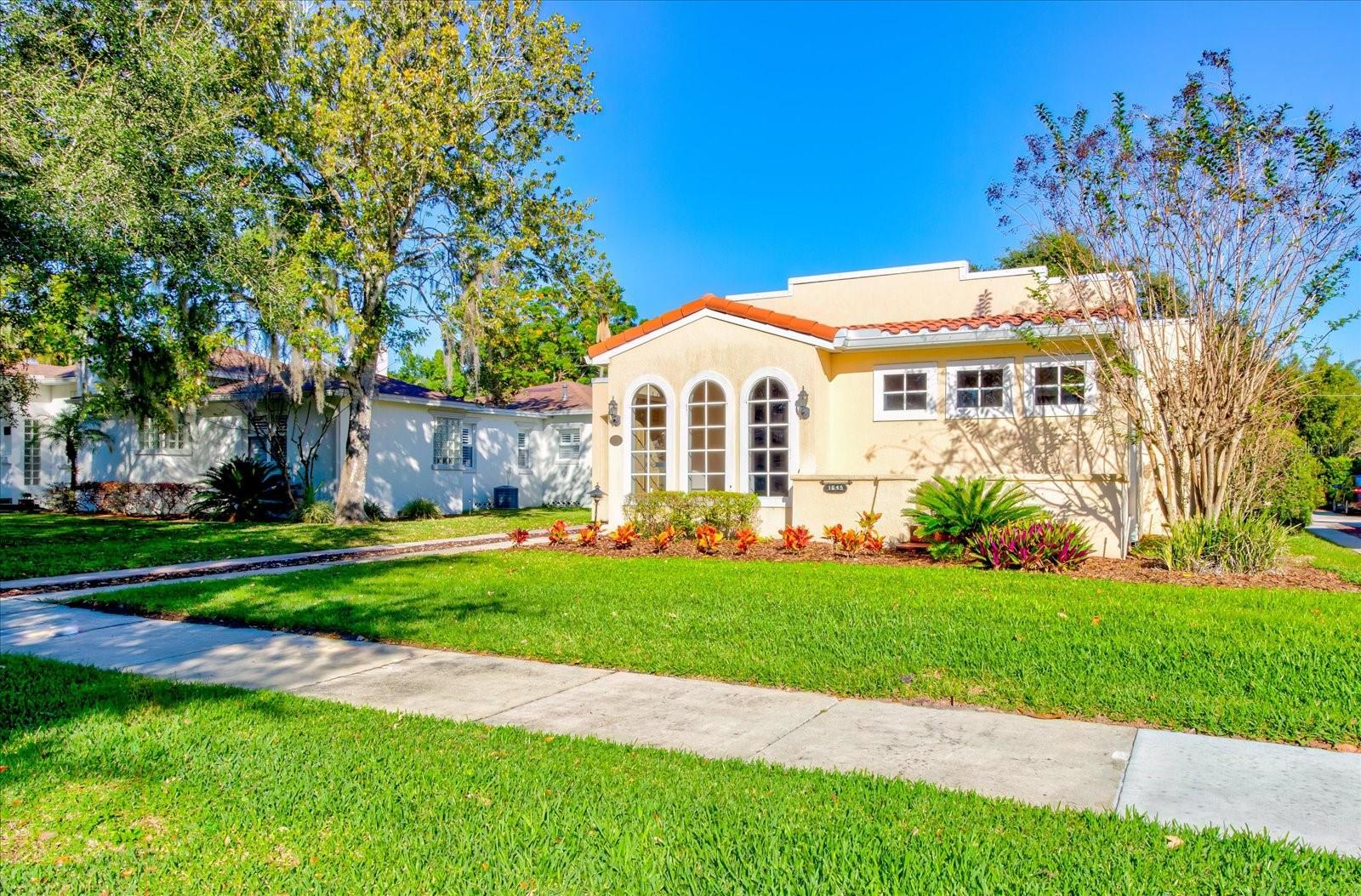 One or more photo(s) has been virtually staged. This charming Orwin Manor POOL home in Winter Park is ready for a new owner!  This home has 2 bedrooms with another room that could be an office or third bedroom, along with two full bathrooms.  The front door entry is filled with light from 3 large arched windows.  As you enter the living and dining spaces, you will notice the original hardwood floors and beautiful gas fireplace for those cozy evenings.  The Kitchen is open to the Family room with high ceilings and both overlook the back yard with Screened Porch and open Pool. The Master bedroom has 2 large closets and adjoins a full bathroom with double sinks and tub/shower.  The Second bedroom can share this bathroom.  Toward the back of the house is another large room that could be used as a 3rd bedroom or office with the second full bathroom nearby.  There is an interior Laundry room off of the Kitchen. With a screened Porch leading to the Pool area, there is plenty of room for lounging and relaxing with friends and family.  Don't miss the large storage/utility room with laundry tub.  Recent upgrades include: Roof replaced 2023, HVAC replaced 2022, electrical panel has been updated and home has fresh interior paint and new carpet. This location is conveniently nestled between  downtown Orlando, College Park  and Winter Park with easy access to shopping and restaurants.   This home has been listed in the City of Winter Park historic register.