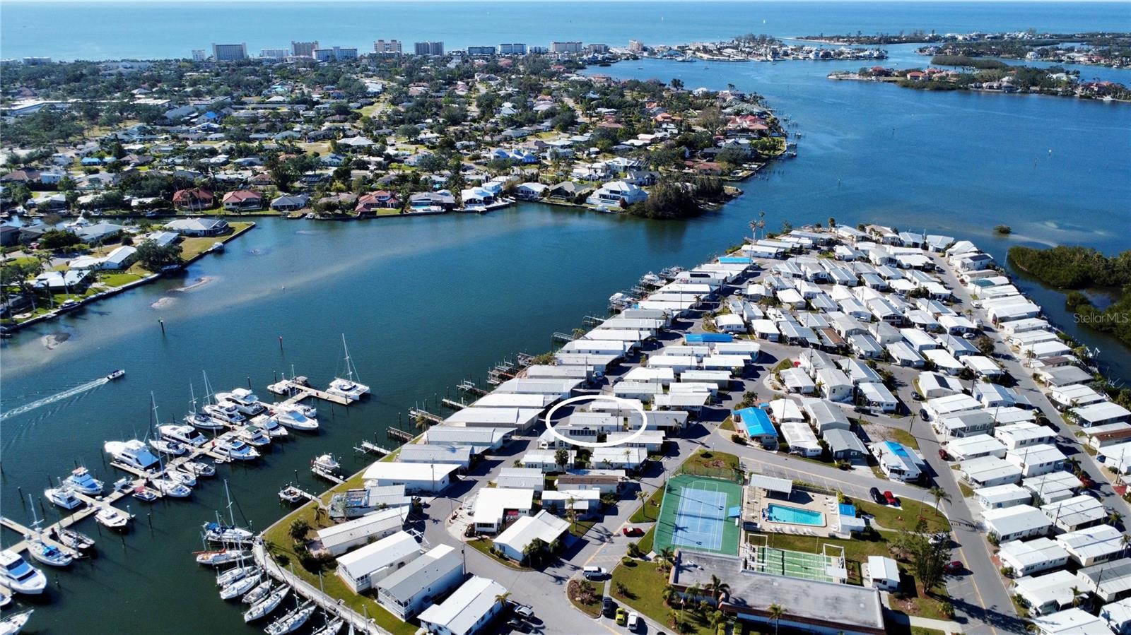 Fantastic opportunity to own in the desirable community of Harbor Lights! Just under 1 mile to Historic Downtown Venice and the Gulf Coast beaches, this location is hard to beat. The Harbor Lights community offers great amenities including a community pool, pickleball and tennis court, and a clubhouse with events throughout the year. This 1-bedroom, 1-bathroom home comes furnished and is ready for a new owner to make it their very own. Recent updates include a brand-new mini-split HVAC system, a newer electrical breaker box, and new vinyl plank flooring in the primary bedroom. Washer and dryer are conveniently located in the shed off the carport. Schedule your showing today!