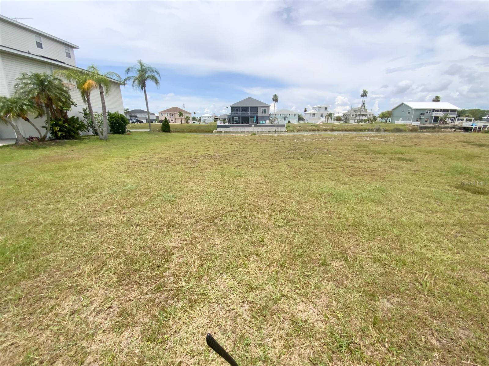 Build Your Dream Waterfront Home in Hernando Beach South...This beautiful 75'x100' waterfront lot in the desirable Hernando Beach South community is ready for your coastal masterpiece. With a low annual HOA fee, you’ll enjoy professional lawn maintenance until your new home is built, plus convenient access to the community boat ramp. Short-term rentals are not permitted, preserving the peaceful, long-term residential character of the neighborhood. Prime location and lifestyle which offers the perfect blend of serene waterfront living and coastal charm. Located in Hernando County along the Gulf of Mexico, this welcoming community is ideal for those seeking a relaxed lifestyle filled with boating, fishing, and natural beauty. Direct waterfront setting with easy access to the Gulf via the community boat ramp. Opportunity for private docks and boat lifts. Nearby Weeki Wachee Springs State Park – perfect for kayaking, paddleboarding, and swimming with manatees. Close to several scenic golf courses. Convenient access to local restaurants, shops, and entertainment. R1B zoning – approved for single-family homes. Hernando Beach South delivers the true Florida coastal lifestyle with stunning waterfront views, abundant wildlife, and a laid-back atmosphere with everything you need. In just 10 minutes, reach US 19 for easy access to Publix, major shopping centers, popular chain restaurants, Walmart, Sam’s Club, and four major hospitals. Tampa International Airport is approximately one hour away, and Walt Disney World is just 90 minutes—making this the ideal balance of peaceful retreat and modern connectivity. Don’t miss this incredible opportunity to own a piece of paradise and build the waterfront home you’ve always dreamed of. Contact us today to schedule a viewing and start planning your coastal retreat!