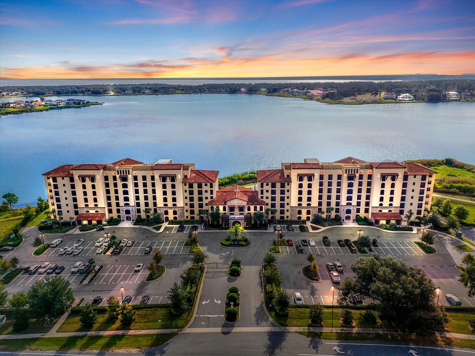 Experience elevated lakefront living in Siena at Bella Collina, one of Central Florida’s premier luxury communities, nestled among the rolling hills of Montverde. This beautifully updated corner-unit condo features 3 bedrooms, 3 bathrooms, and some of the most breathtaking views of Lake Sienna in the community. The desirable corner-unit location offers enhanced privacy and wider panoramic views from the main living areas, primary suite, and private screened balcony. Recent upgrades include an $8,000 Culligan whole-home water filtration system, a Laundry Pure water treatment system, a new washer and dryer, new carpet, fresh interior paint, a professionally cleaned HVAC system, UV light, and a dehumidifier. The open-concept floor plan is filled with natural light and showcases quartz countertops, 42-inch cabinetry, stainless steel appliances, crown molding, tray ceilings, and porcelain tile flooring throughout the main living spaces. The spacious primary suite offers stunning lake views, a walk-in closet, and a spa-inspired bathroom with dual vanities and a frameless glass shower. Two additional bedrooms and bathrooms provide flexibility for guests or a home office. Residents of Siena at Bella Collina enjoy maintenance-free living with access to a heated lakefront pool with a cabana, fitness center, conference room, barbecue area, fire pit, fishing pier, elevator access, and beautifully maintained grounds. HOA dues include cable, internet, water, sewer, trash, exterior maintenance, insurance, and security. Optional membership to The Club at Bella Collina offers access to world-class amenities, including the championship golf course designed by Sir Nick Faldo, tennis, spa services, fitness facilities, dining, and a resort-style pool. Conveniently located near Montverde Academy with easy access to the Florida Turnpike, SR-429, Winter Garden, Clermont, and Orlando.