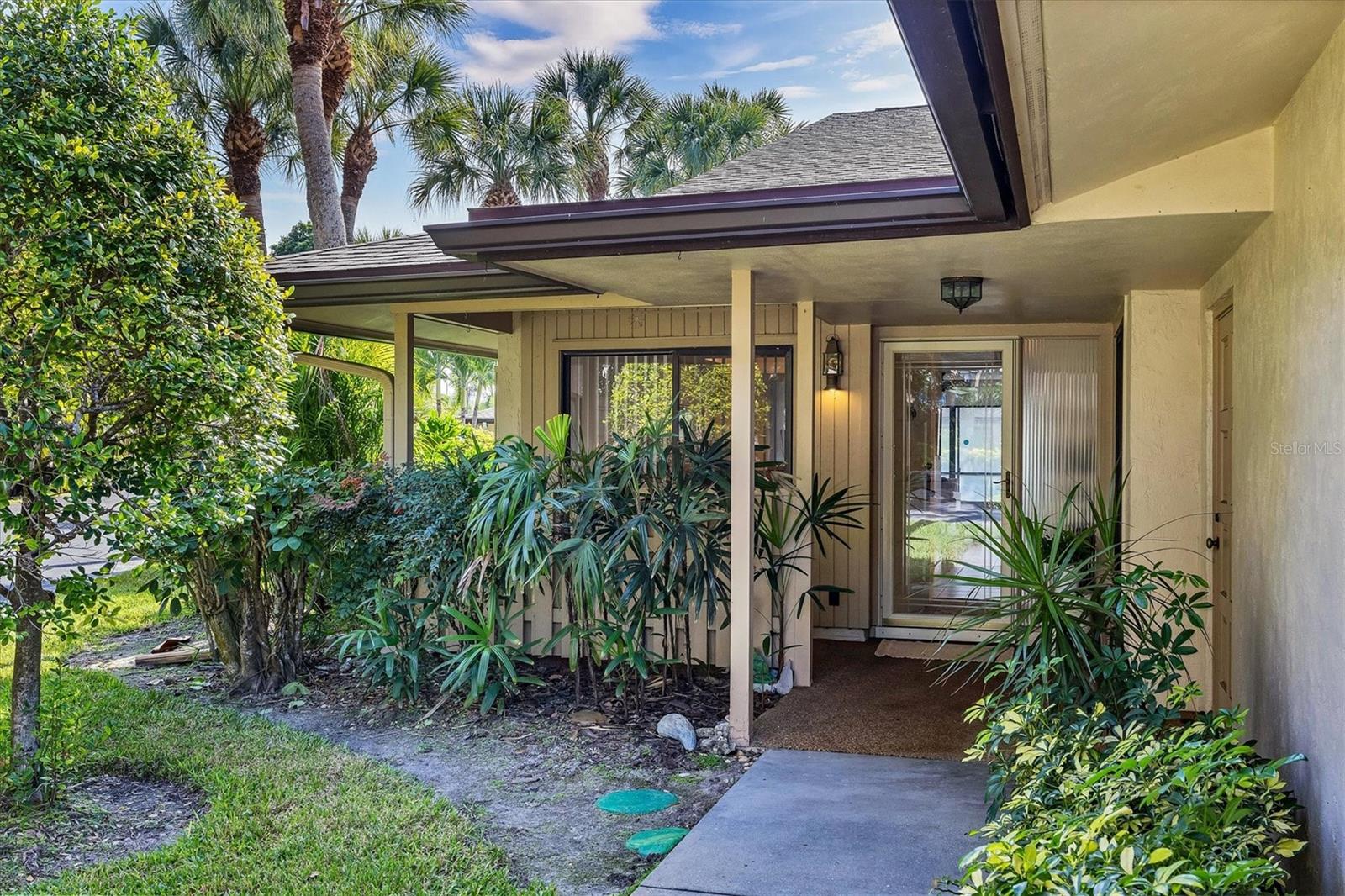 Salt Water Canal Front - West of the Trail - Walk or Bike to Siesta Key Beach... Experience the best of coastal living in this sun-filled, spacious 2-bedroom, 2-bath residence nestled within the highly sought-after, gated boating community of Schooner Bay—just minutes from Siesta Key. Gentle coastal breezes flow through the home, while the expansive screened lanai offers an inviting setting for morning coffee or evening cocktails at sunset.  Priced to allow Buyer to fully remodel to their desires without concerns of over investing.. 

This exceptional waterfront property includes a rare deeded boat slip..  with water and electric, providing direct access to the bay with no bridges—an ideal arrangement for boating enthusiasts. A private 1-car garage adds convenience and security. Inside, the thoughtfully designed split floor plan offers generous living spaces, in-unit laundry, and outstanding flexibility for comfortable everyday living or seasonal use.

The primary suite features a spacious en-suite bath and private access to the lanai, creating a serene retreat. Notably, the residence remained unaffected by the 2024 storms, with no water intrusion or damage, offering additional peace of mind.

Residents of Schooner Bay enjoy access to a heated community pool and clubhouse, all in a prime location near world-renowned beaches, shopping, dining, healthcare, and downtown Sarasota. The HOA provides a truly maintenance-free lifestyle, covering roof, sidewalks, gutters, flood insurance, and landscaping.

An exceptional opportunity to personalize and enhance a waterfront property in a premier location—this is coastal living at its finest.

*Property is currently located in FEMA Flood Zone X according to available public records; Buyer to independently verify.