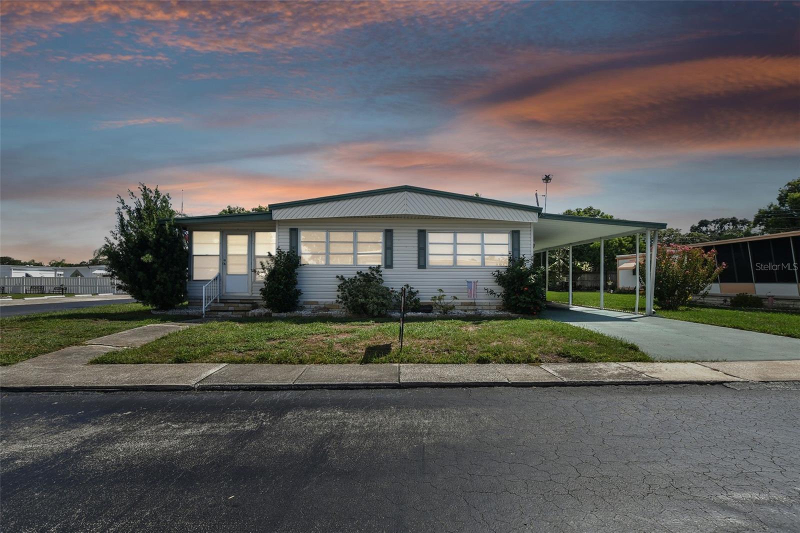 PARK OF THE YEAR 2 years running!! Enjoy this corner 2 bedroom2 bathroom unit steps to the clubhouse. Fully furnished and you even get access to the Golf cart. Availble Seasonal Only. Available Dec 2023- May 2024.. Enjoy nature all around with this community that backs up to Lake Semiinole. Bring your boat, kayak, jet ski and more!! Close to retatil shopping, grocery, restaurants, theaters and so much more!!. This age qualified park has a heated pool, great clubhouse with lots of activities, shuffleboard and more. The unit has an inside laundry , out door grill, and large carport. So hurry this one will not be available long.