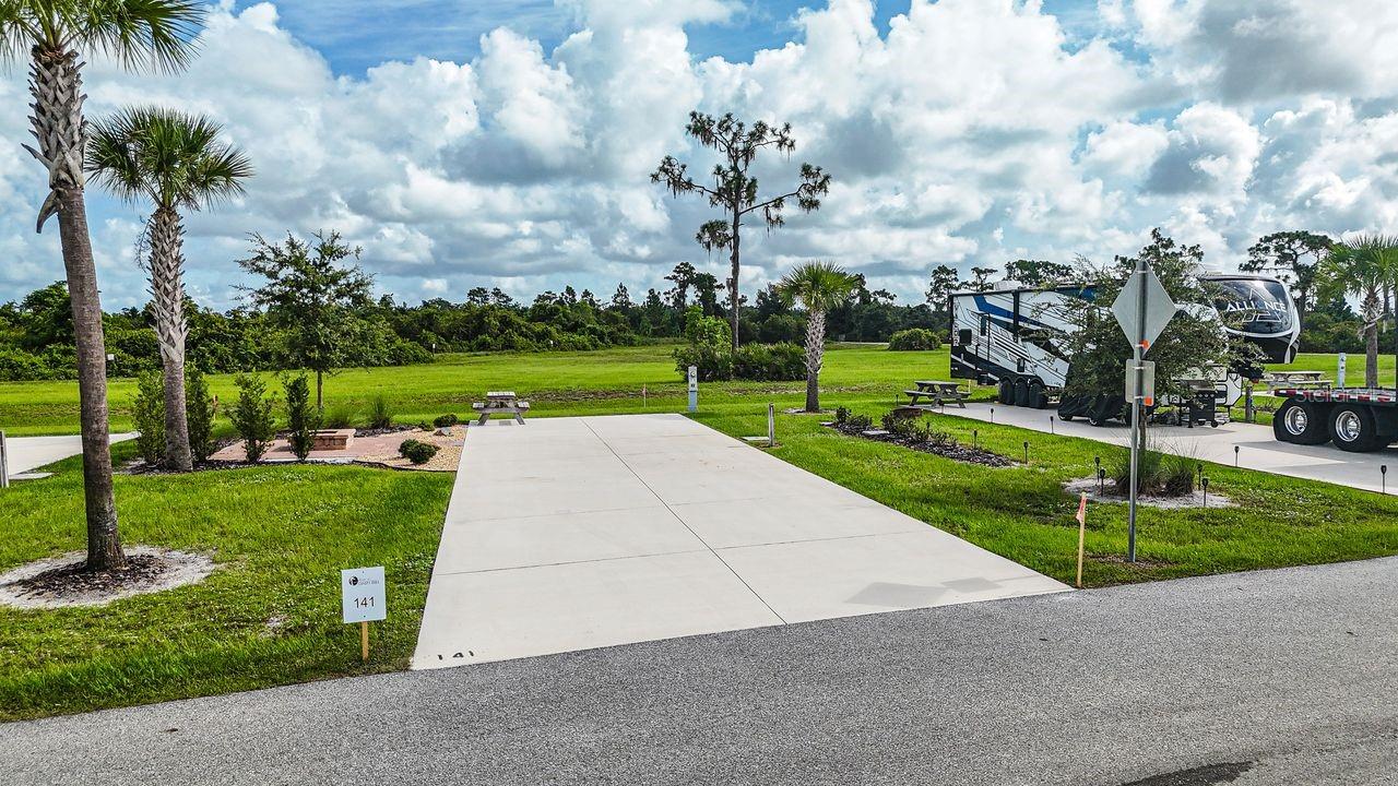 Lot 141 is a premium preserve-view lot offering a peaceful natural backdrop and enhanced outdoor living space. Backing directly to the nature preserve, this property provides added privacy and a tranquil setting rarely available within the community.

The upgraded paver patio creates an expansive and inviting space perfect for outdoor dining, entertaining, or designing your own custom outdoor kitchen or lounge area. Whether bringing your RV or planning a future tiny home retreat, this lot delivers flexibility, comfort, and long-term appeal.

Ownership includes deeded property within Resort at Canopy Oaks, a professionally managed, gated luxury RV and tiny home resort in Central Florida known for its resort-style amenities and strong ownership value. Ask about current developer incentives and potential rental income. 

Schedule your private tour and experience the charm and privacy of this preserve-side opportunity.