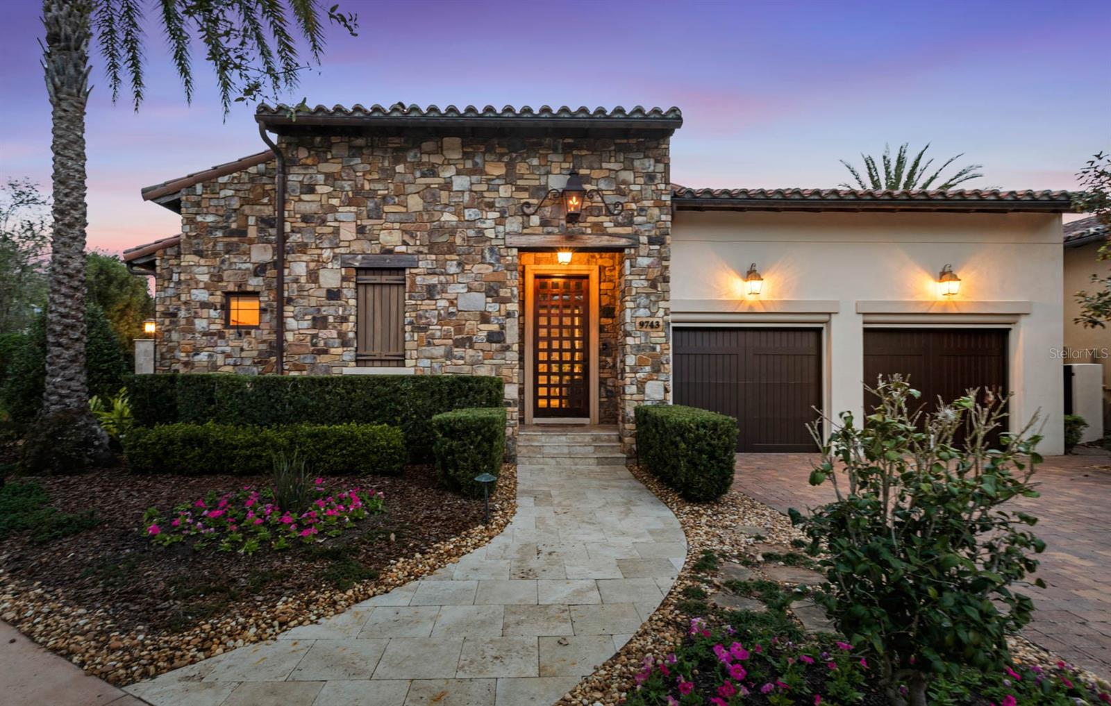 Step into a place where storybook design meets a little everyday magic. Tucked inside the sought after Kimball Trace neighborhood of Walt Disney World's Golden Oak, this 4,668 square foot, 6 bedroom, 6 and a half bathroom residence feels both thoughtfully curated and effortlessly livable. Built in 2014 by ISSA Homes, every space is designed to bring people together while still offering quiet moments of retreat. At the center of the home, a serene courtyard pool sets the tone. It's a private oasis that invites morning coffee, afternoon swims, and evenings under the stars. Nearby, the casita offers an escape for guests or a home office, with its own morning bar, full bath, and walk-in closet.  Inside the main residence, the home flows beautifully from space to space. The kitchen is equal parts functional and inviting, featuring dual refrigerators, a freezer, and a full-sized wine fridge, all wrapped in cabinet-level finishes. A generous quartz island comfortably seats five, while two separate dining areas allow for everything from casual family meals to festive gatherings. The first floor primary suite is a peaceful retreat with dual sinks, an oversized shower, abundant counter space, and a spacious walk in closet. A third suite on the main level adds flexibility and works just as easily as a nursery, office, or secondary bedroom. Upstairs, a cozy loft welcomes you before leading to three additional suites. One functions beautifully as a secondary primary, while two others are thoughtfully designed with bunk beds and private baths, creating spaces that feel both playful and practical. Modern conveniences are woven throughout, including smart home features and a mini split AC unit in the garage for year round comfort. And just steps away, Summerhouse awaits with its private fitness center, two restaurants, zero entry pool, social events, and dedicated concierge team. This is more than a home. It is a place where comfort, connection, and a touch of magic come together. Call today to schedule your private showing.