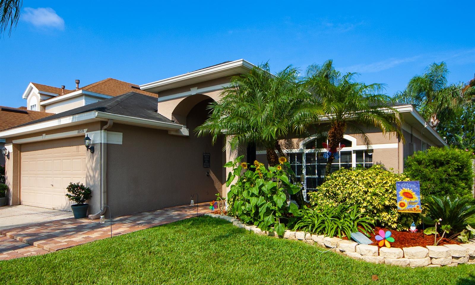 Welcome to 10719 Cherry Oak Circle, a stunning 3 bedroom, 2 bathroom home located in the popular part of Orlando. This 1579 square foot property sits on 0.25 acres and has been recently inspected with 4-point inspections so you can move right in with peace of mind. Stainless steel appliances, restaurant style sink and faucet, master bathroom shower and tub remodel w/frameless enclosure, LVP flooring, fresh paint interior and exterior, water heater, replumbed with PEX piping, landscaping and drainage. Wired for outdoor lighting. Roof 2014 The moment you step inside this beautiful home you will be welcomed by volume ceilings and skylights that create an airy and spacious atmosphere throughout the living areas. The bright open floor plan allows for plenty of natural light to fill each room while vinyl floors make it easy to keep clean! Additionally, there are also two generously sized bedrooms accompanied by walk in closets so storage is not an issue here! The home has gas hot water and heat as well pas piped for gas stove. The master suite boasts its own private oasis with updated bathrooms including a relaxing garden tub where you can soak away your worries after a long day at work or school. The master bath provides plenty of space and privacy for everyone who lives here as well! When it's time to kick back outside, don't miss out on this magnificent outdoor living area complete with professionally landscaped gardens so that your friends & family can enjoy quality time together surrounded by nature's beauty. The backyard truly completes this spectacular property thanks to the PRIVACY FENCED YARD which keeps nosy neighbors at bay! Plus, parking is made simple & secure courtesy of the large two car garage - no more fighting over spots during rush hour traffic ever again! This wonderful residence offers endless conveniences such as being close to shopping centers making errands quick & convenient plus nearby highways such as Hwy 417 ensure easy access wherever life takes you next – even UCF is only minutes away from here too! Don’t wait any longer – call today and schedule a showing appointment before someone else beats you to it - You won’t want to miss out on experiencing 10719 Cherry Oak Circle first hand! ;Water: City