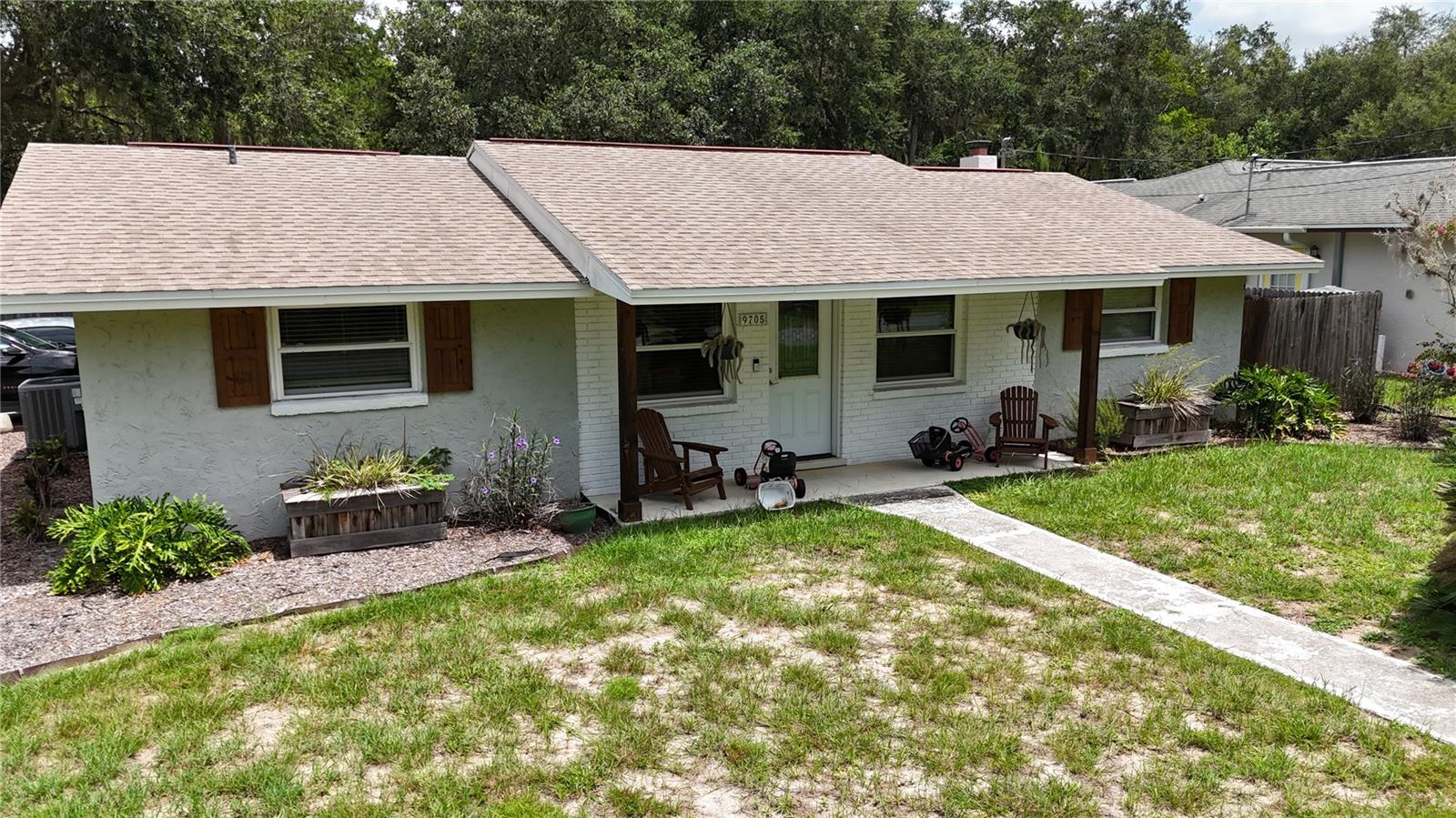 Paradise Country Club Estates is a very nice neighborhood located on the southwest side of Crystal River. This area is not deed-restricted, yet the homes and lawns are very well-kept. No deed restrictions mean this home can be used as a short-term rental or allow you to park your boats and RV on the site. Easy access to the fenced backyard storage area can be made through the gate, with a perfect spot for the toys. A large storage/utility shed is also included. Using your boat has never been easier with access to multiple boat ramps within 1-2 miles of the subject property's location. Crystal River is a rapidly expanding area offering multiple opportunities for dining, shopping, and convenient travel to the state's metro areas. Traveling the State has never been easier from this West Central Florida Location. Inside the home, you will find a tastefully updated, oversized kitchen with newer cabinets, countertops, and appliances. Other updates include a new roof in 2017 and dual-pane vinyl windows throughout. A split bedroom floor plan, with a large living room off the back of the home, provides ample space for guests and entertaining. Upfront, there's a family room which lends itself perfectly to accommodate working from home, crafts,  and/or a kids' play area. This home and location make for the perfect opportunity for someone to come and live and love all that Florida's Nature Coast has to offer.